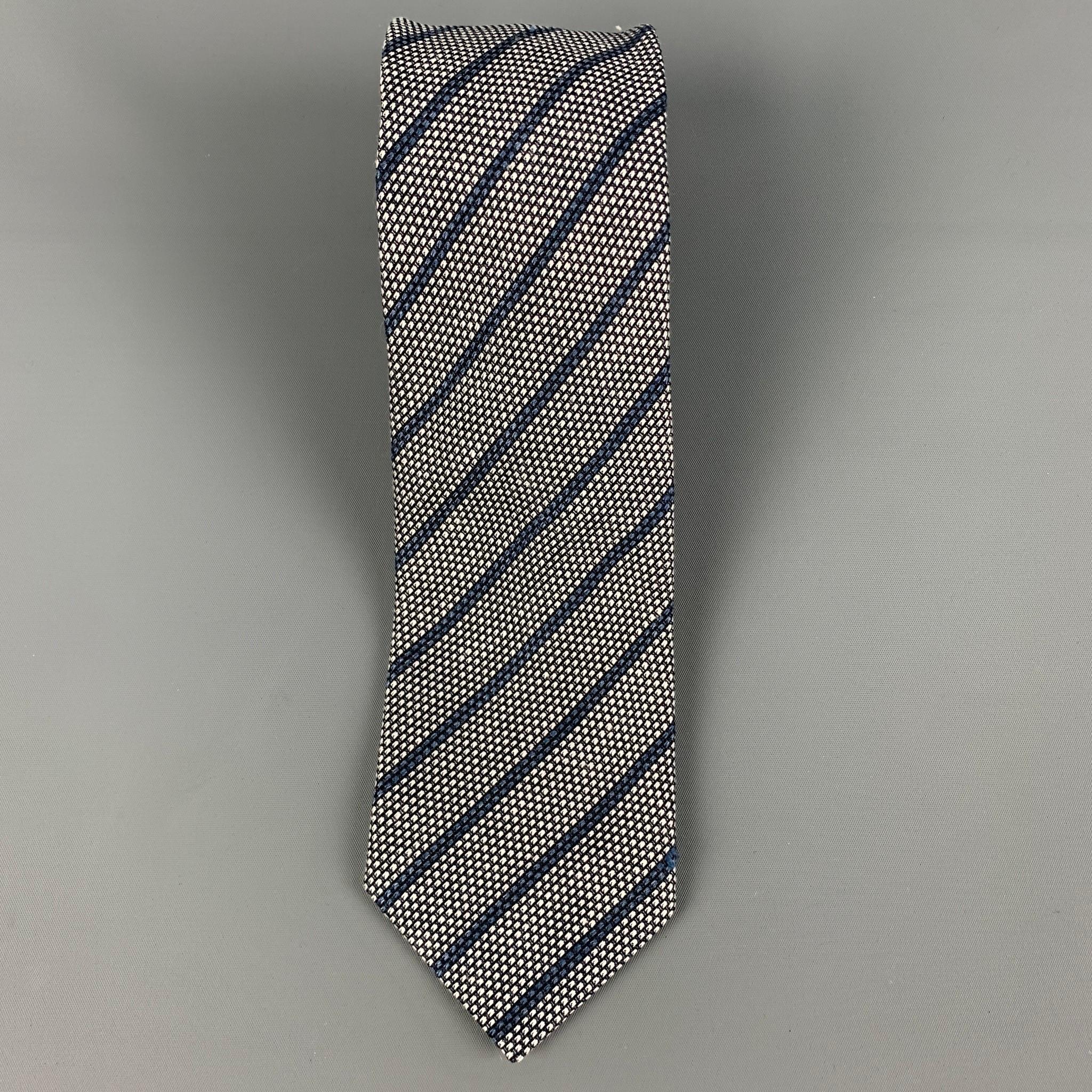 ERMENEGILDO ZEGNA necktie comes in a grey & navy silk with a all over stripe print. Made in Italy.

Excellent Pre-Owned Condition.

Measurements:

Width: 3.2 in. / 8 cm.
Length: 60 in. / 152 cm. 