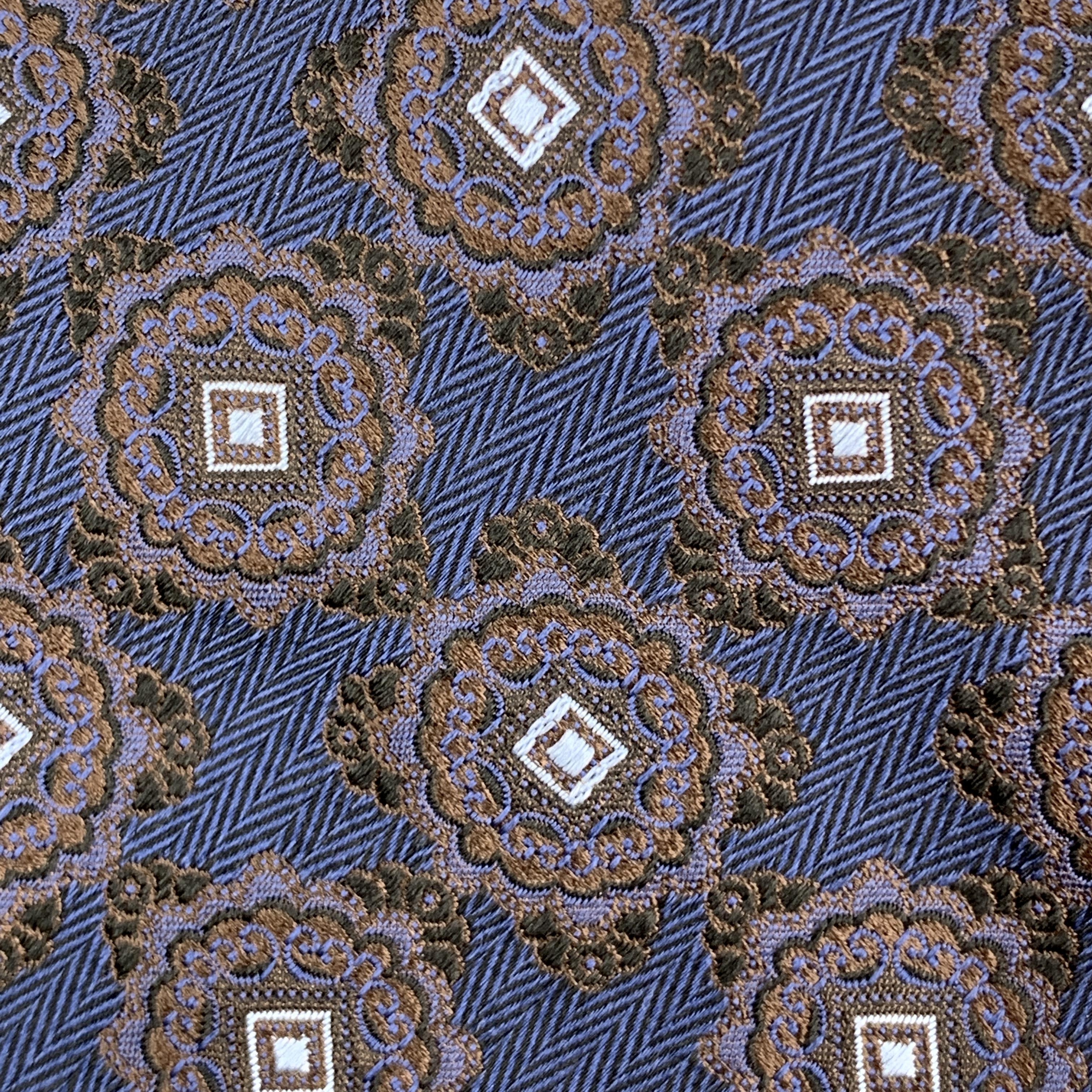ERMENEGILDO ZEGNA necktie comes in navy silk with all over brown damask print. Made in Italy.

New with Tags.

Width: 3.5 in.
