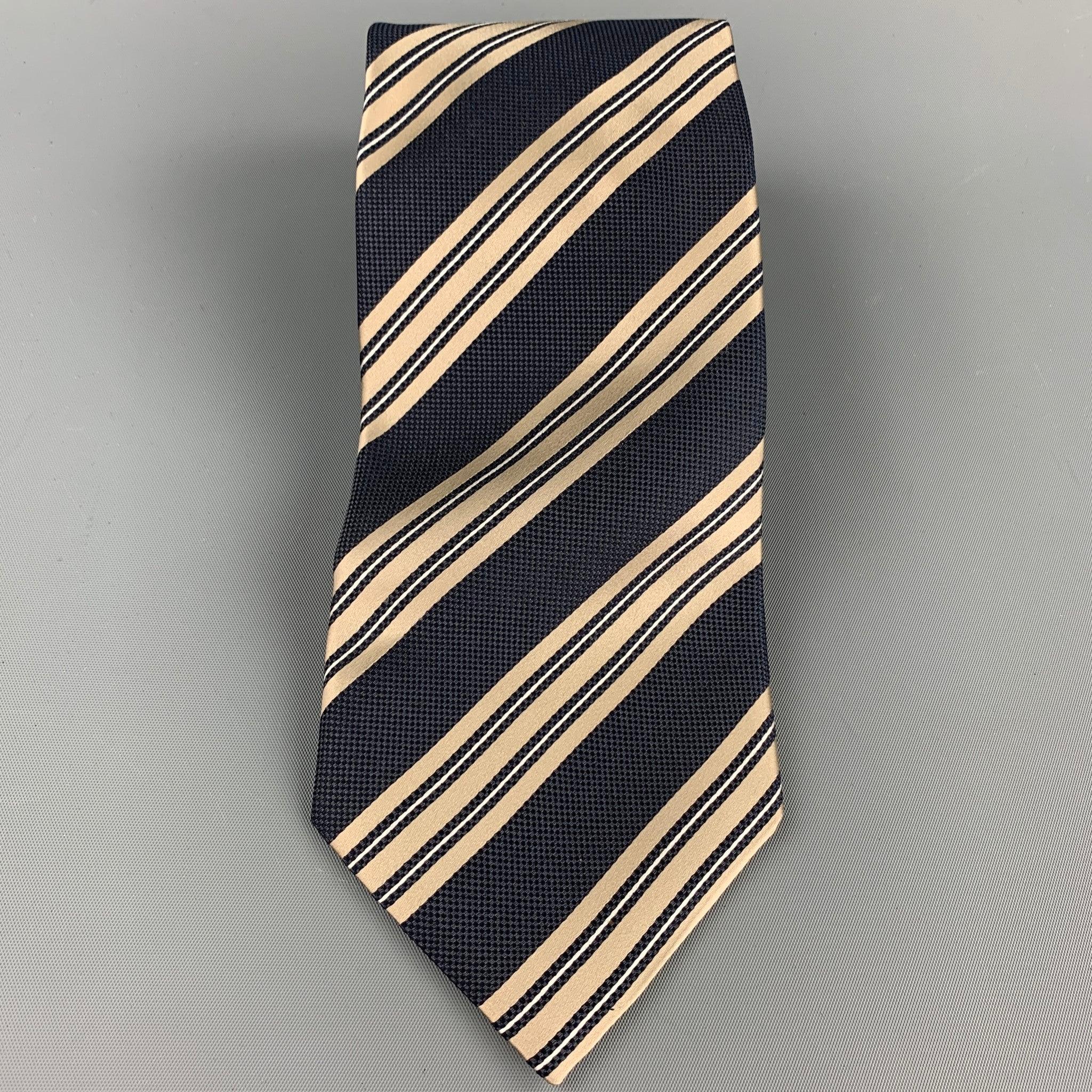 ERMENEGILDO ZEGNA tie comes in a navy & taupe diagonal stripe silk. Made in Italy.Very Good Pre-Owned Condition.Width: 4 inches  
  
  
  
 Sui Generis Reference: 107871
 Category: Tie
 More Details
  
 Brand: ERMENEGILDO ZEGNA
 Color: Navy
 Color
