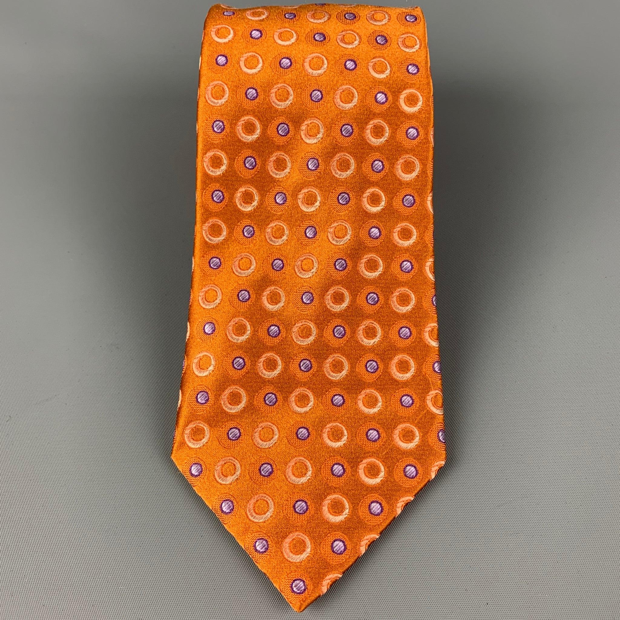 ERMENEGILDO ZEGNA
 necktie comes in a orange & purple silk with a all over dot print. Made in Italy. Very Good Pre-Owned Condition. 
 

 Measurements: 
  Width: 3.75 inches Length: 60 inches 
  
  
  
 Sui Generis Reference: 120668
 Category: Tie
