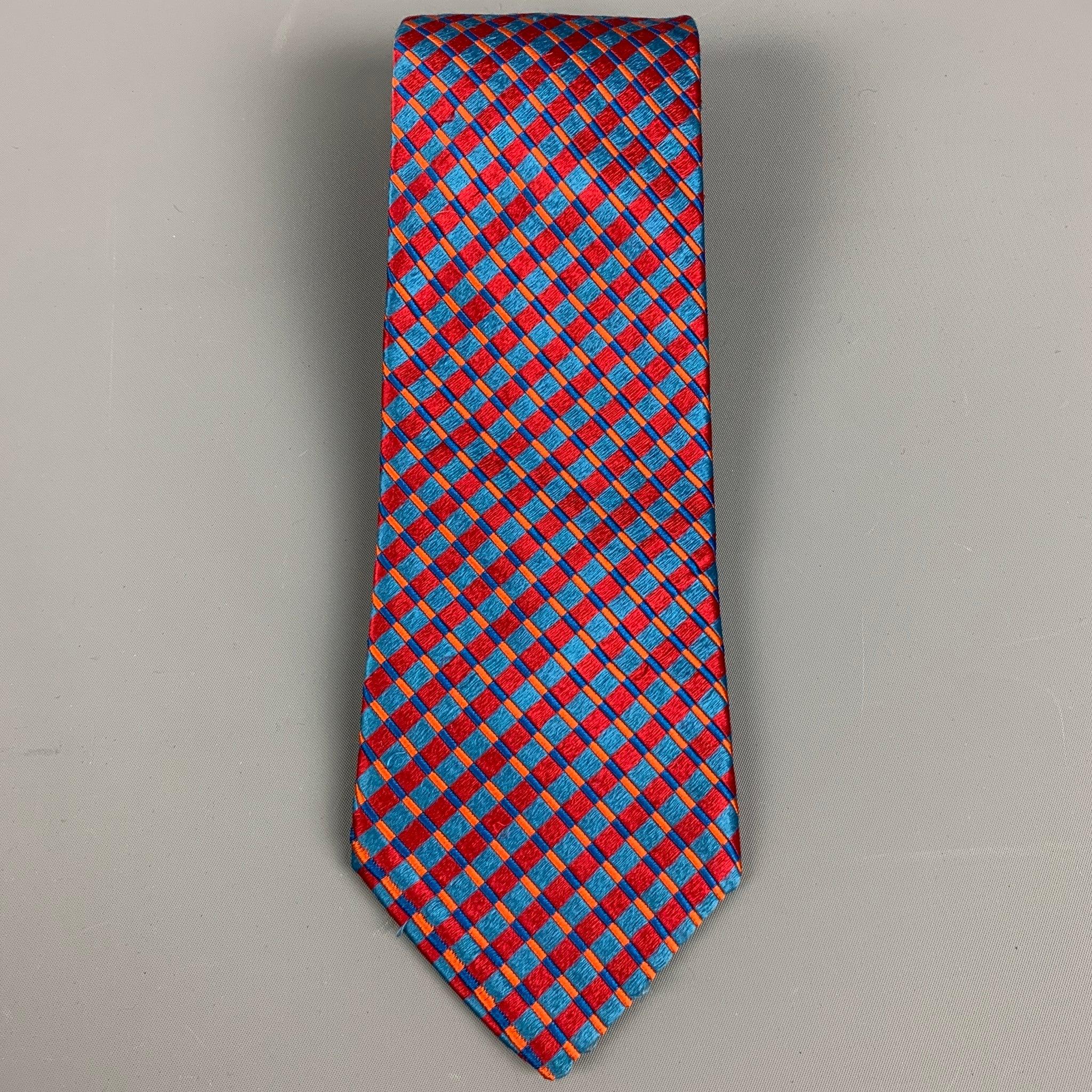 ERMENEGILDO ZEGNA
necktie in a
red and blue silk satin featuring vibrant rhombus jacquard pattern. Made in Italy.Very Good Pre-Owned Condition. Minor signs of wear. 

Measurements: 
  Width: 3.5 inches Length: 60 inches 
  
  
 
Reference: