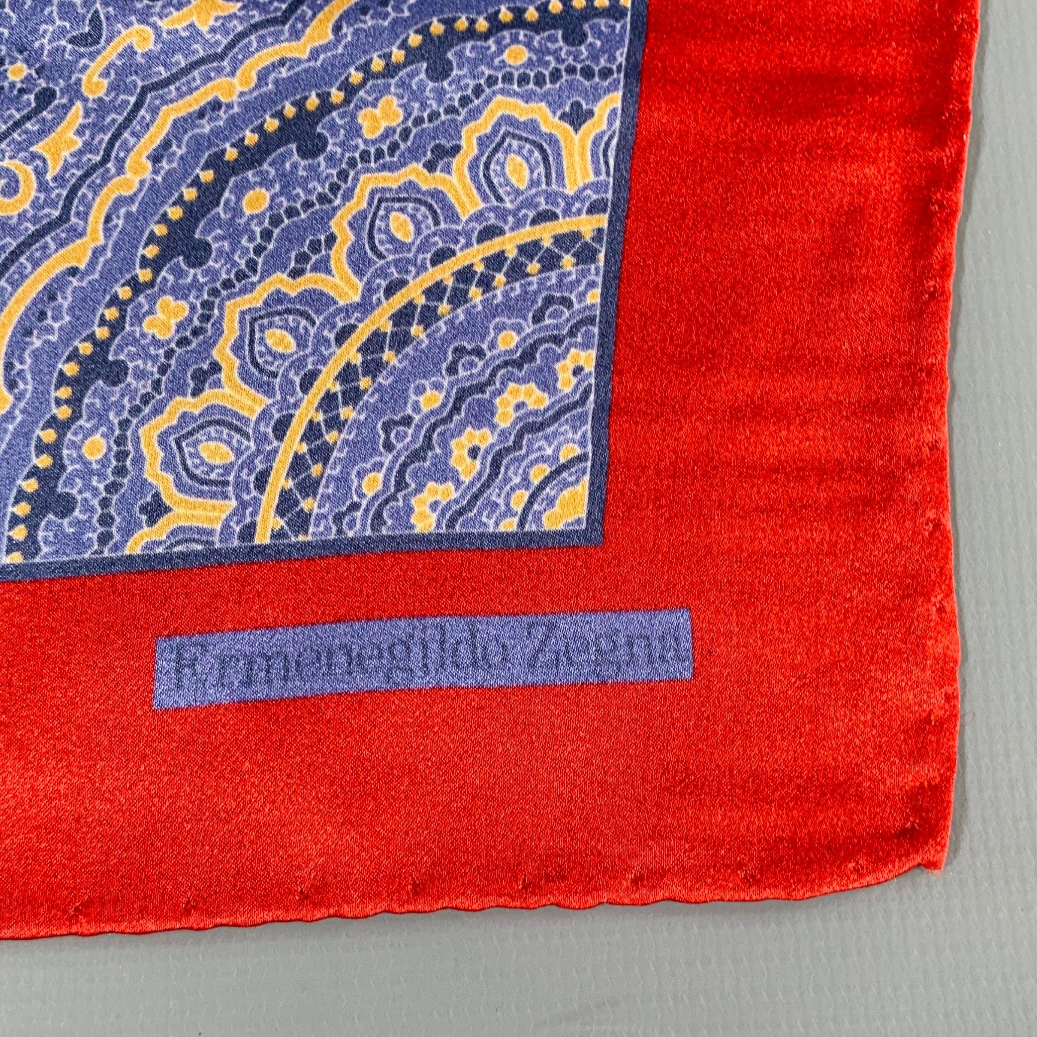 ERMENEGILDO ZEGNA
pocket square in a red and blue silk fabric featuring a mandala print, and picture frame border. Made in Italy. Very Good Pre-Owned Condition. 

Measurements: 
  15.5 inches  x 15.5 inches 
  
  
 
Sui Generis Reference: