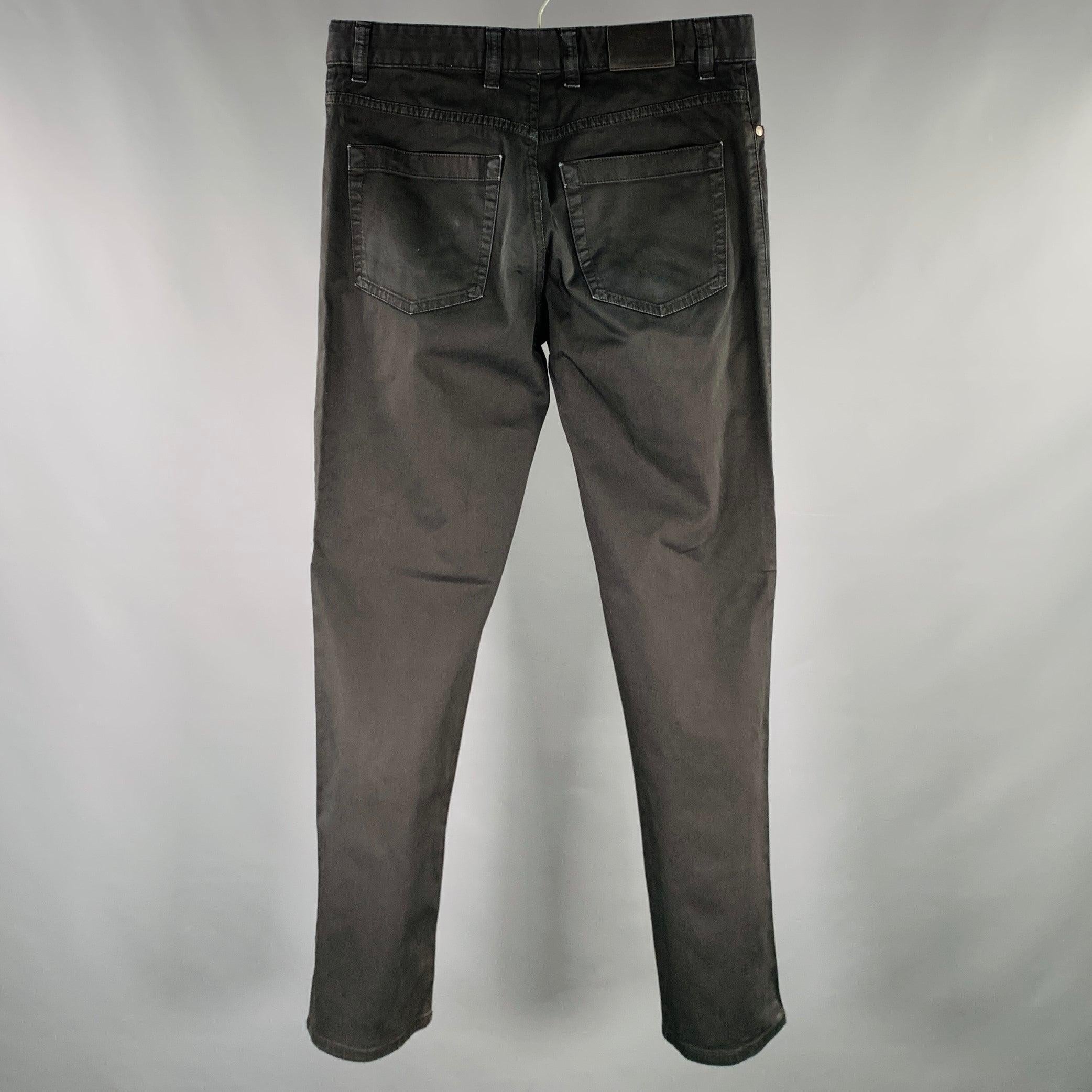 ERMENEGILDO ZEGNA jeans in a black cotton stretch blend fabric featuring a five pockets style, straight leg, and zip fly closure. Made in Romania.Very Good Pre-Owned Condition. Minor marks and fading. 

Marked:   33 

Measurements: 
  Waist: 33