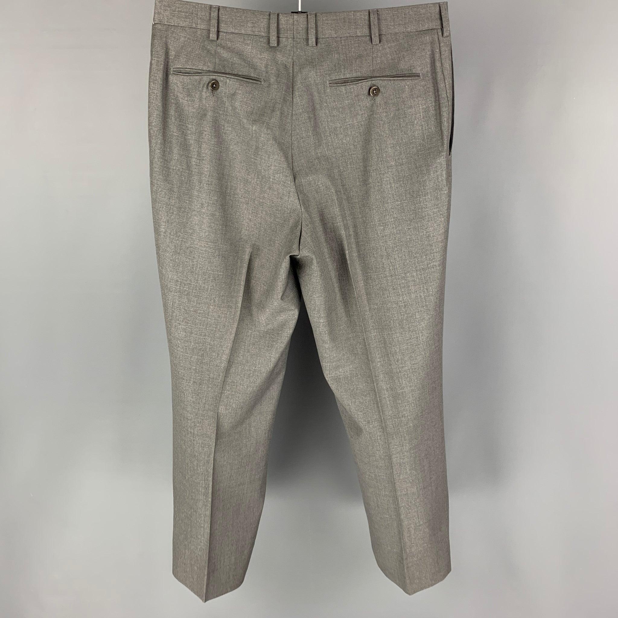 ERMENEGILDO ZEGNA dress pants comes in a grey wool 
featuring a flat front and a zip fly closure.
Very Good
Pre-Owned Condition. 

Marked:  36 R 

Measurements: 
 Waist: 34 inches Rise: 11 inches Inseam: 38 inches Leg Opening: 18 inches 
 
 
