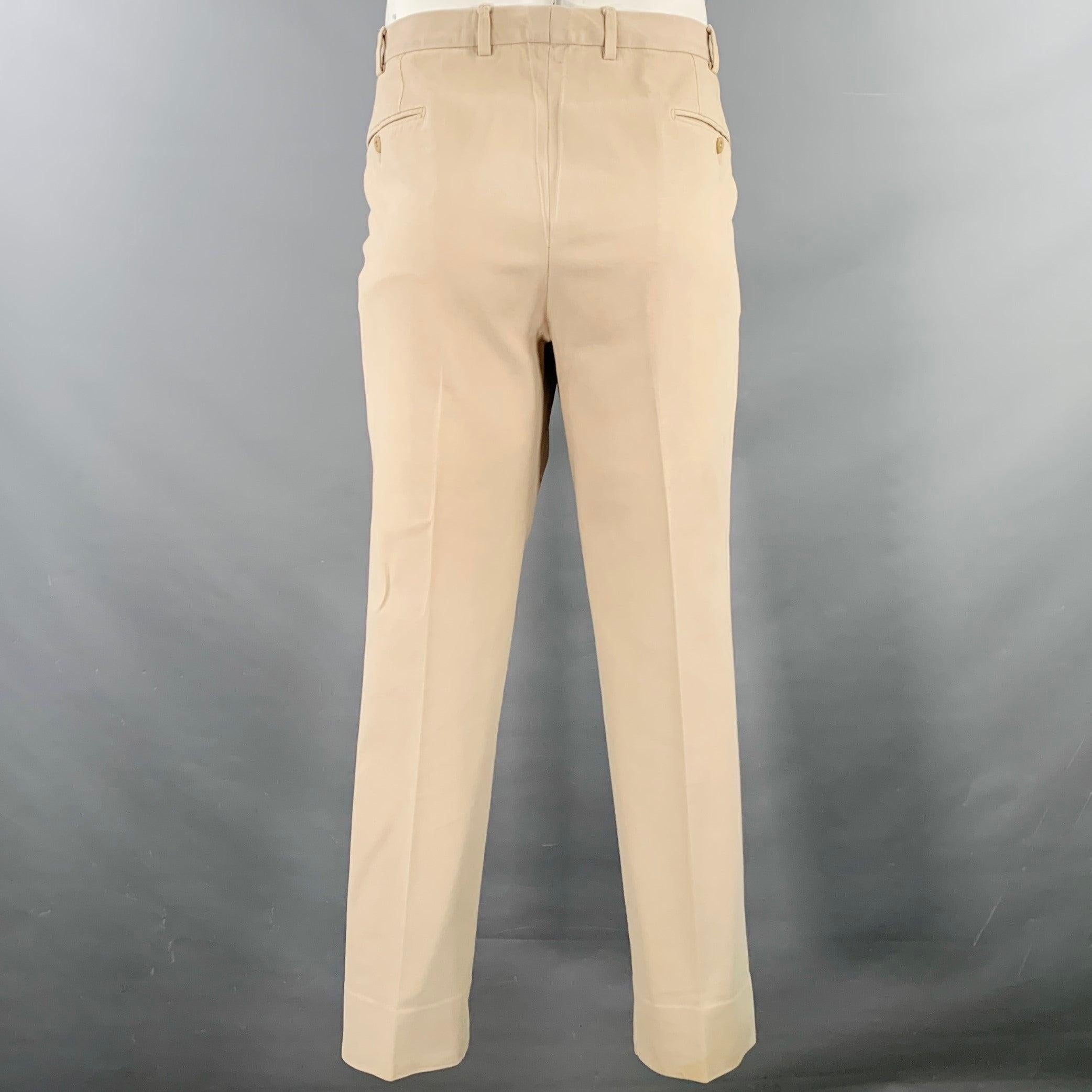ERMENEGILDO ZEGNA casual pants
in a beige cotton stretch blend twill featuring a flat front style, straight leg, and zip fly closure. Made in Switzerland.Good Pre-Owned Condition. Waist has been taken out, moderate marks and discoloration. Please