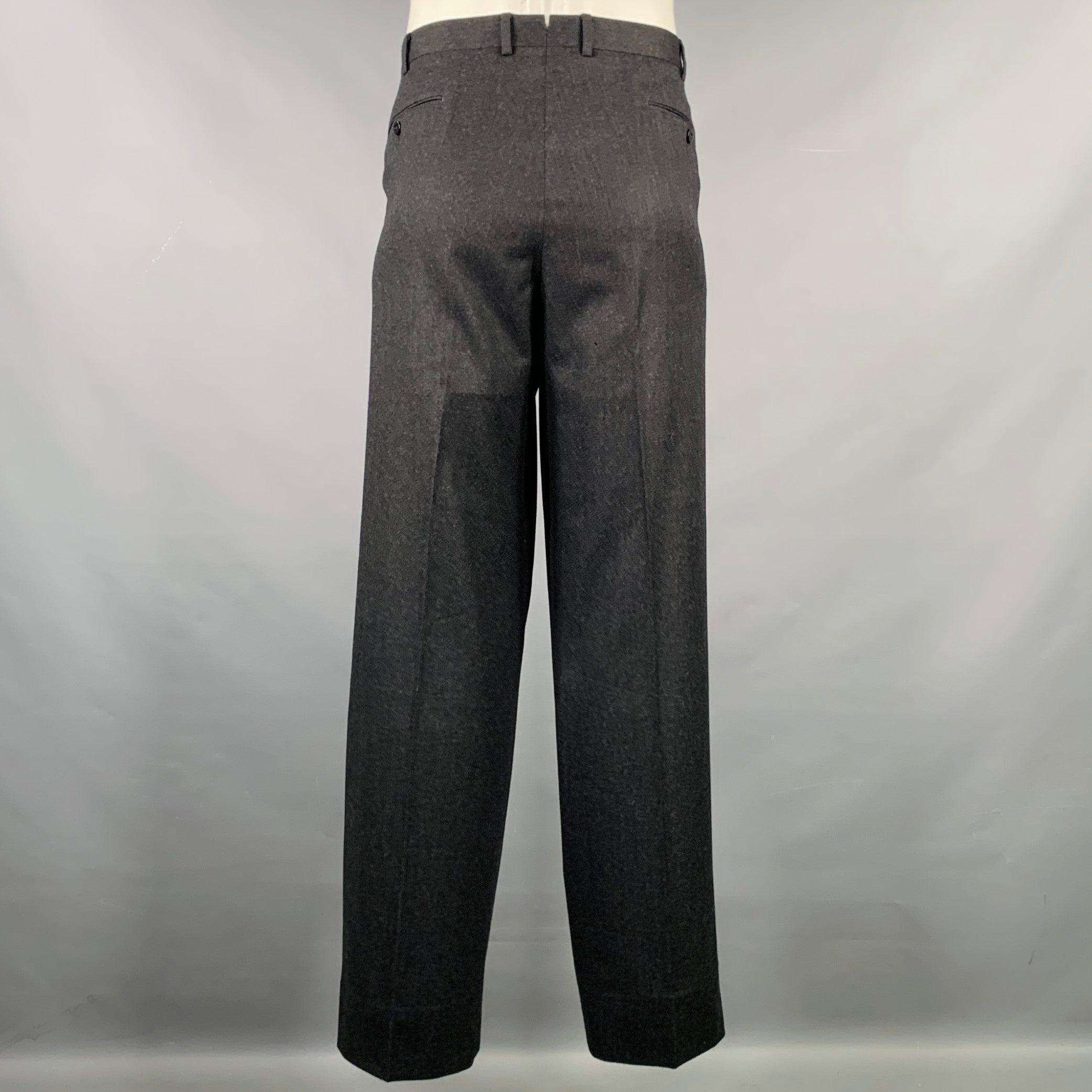 EMENEGILDO ZEGNA dress pants
in a charcoal grey wool fabric featuring a flat front style, straight leg, and zip fly closure. Made in Romania.Excellent Pre-Owned Condition. 

Marked:   38 

Measurements: 
  Waist: 38 inches Rise: 9.5 inches Inseam: