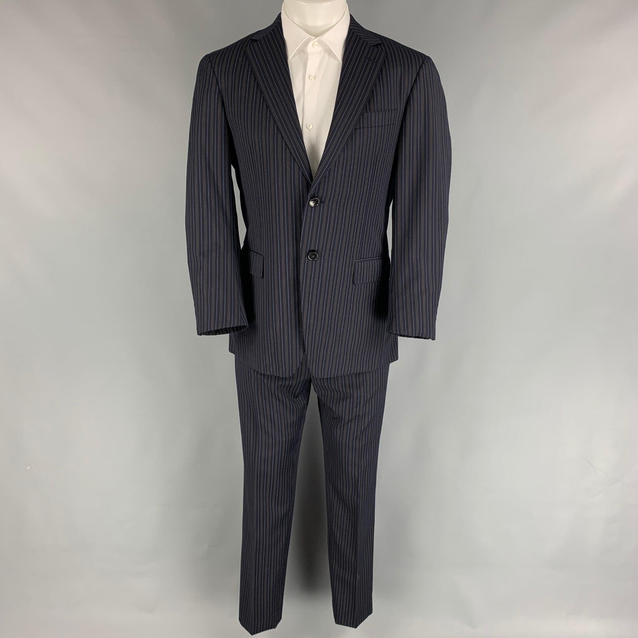 ERMENEGILDO ZEGNA
suit comes in a navy & brown stripe wool with a full liner and includes a single breasted,
 double button sport coat with a notch lapel and matching flat front trousers. Very Good Pre-Owned Condition. 

Marked:   48 

Measurements: