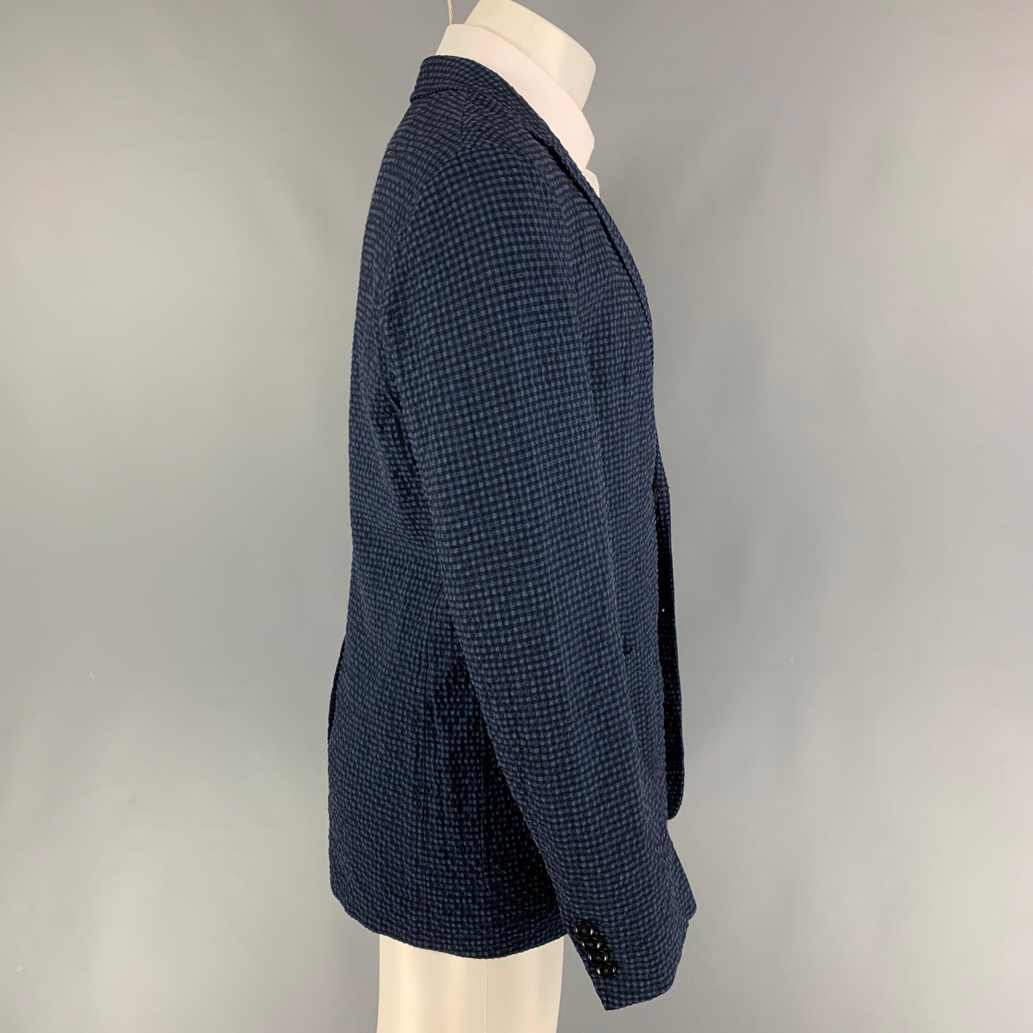 ERMENEGILDO ZEGNA sport coat comes in a blue & black gingham wool blend featuring a notch lapel, patch pockets, single back vent, and a double button closure. 

New With Tags. 
Marked: 50

Measurements:

Shoulder: 18 in.
Chest: 40 in.
Sleeve: 26.5