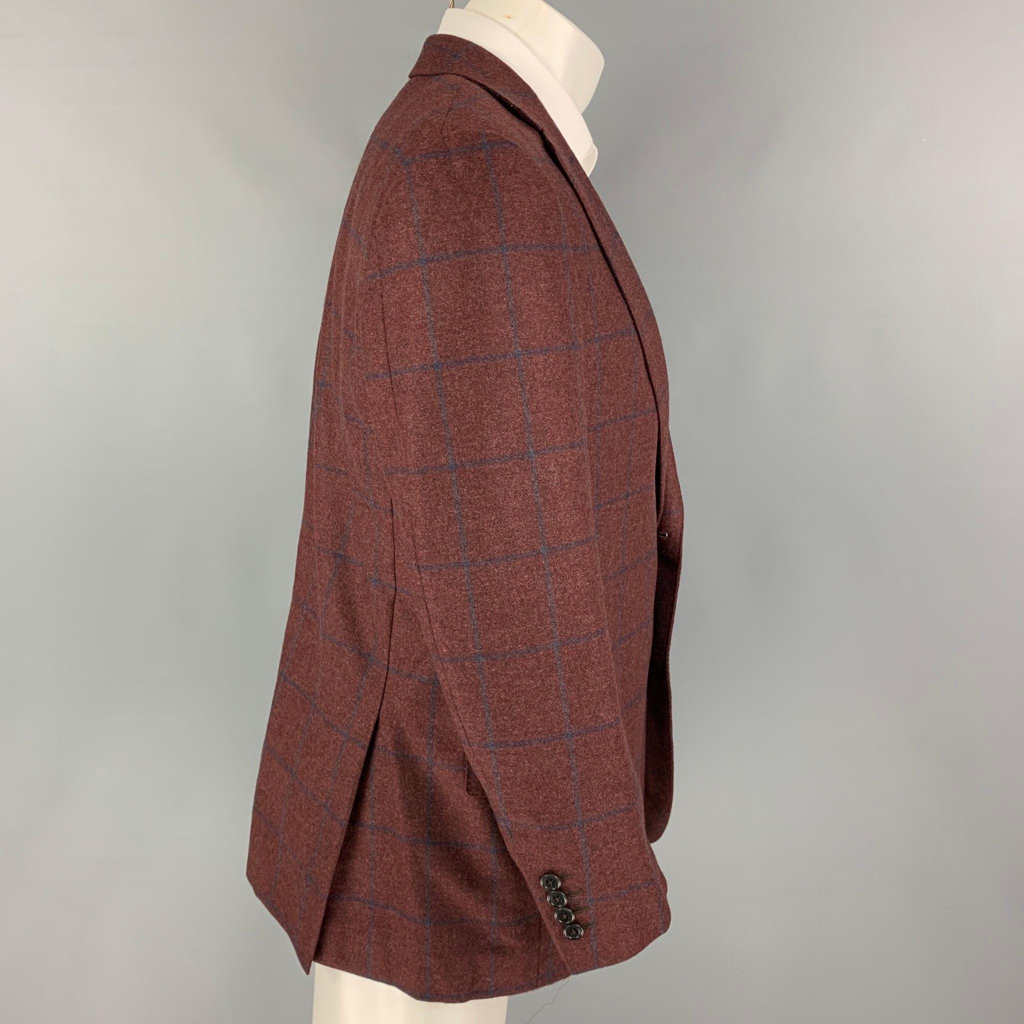 ERMENEGILDO ZEGNA sport coat comes in a burgundy & navy window pane cashmere with a full liner featuring a notch lapel, flap pockets, double back vent, and a double button closure. 

Excellent Pre-Owned Condition.
Marked: 50