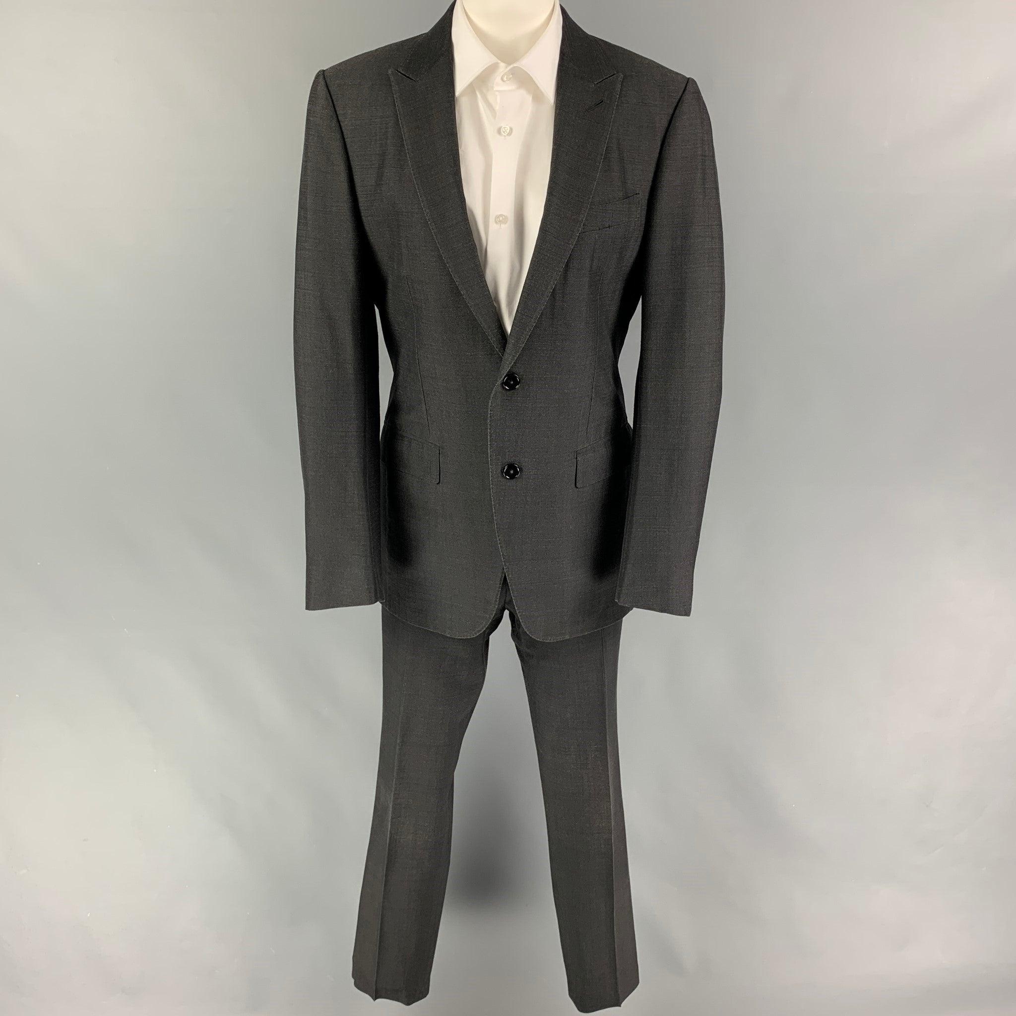 ERMENEGILDO ZEGNA
suit comes in a charcoal silk / wool and includes a single breasted, double button sport coat with a peak lapel and matching flat front trousers. Very Good Pre-Owned Condition. 

Marked:   50 R  

Measurements: 
  -JacketShoulder: