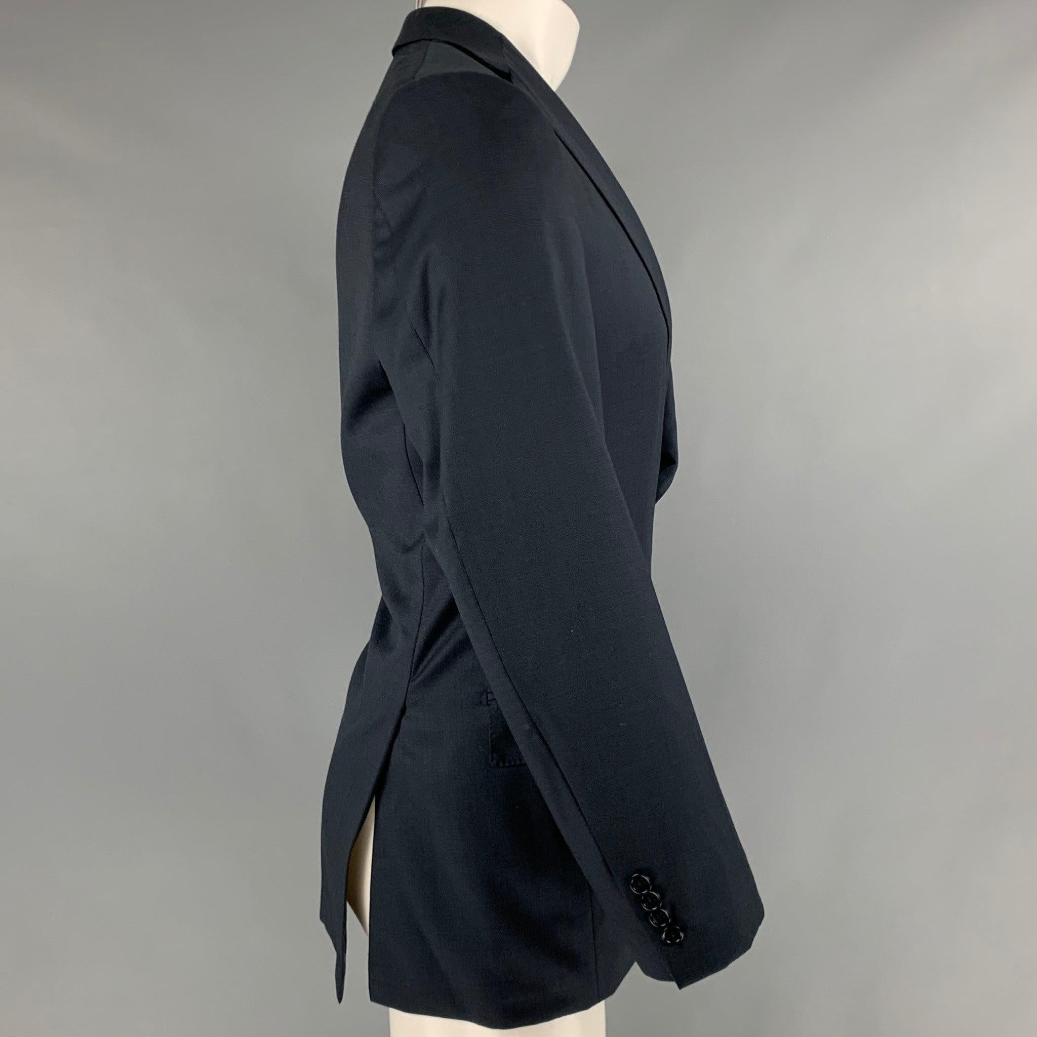 ERMENEGILDO ZEGNA sport coat
in a navy and black wool fabric featuring a nailhead pattern, notch lapel, double vented back, and double button closure. Very Good Pre-Owned Condition. Minor marks and signs of wear. 

Marked:   7-50R 

Measurements: 
