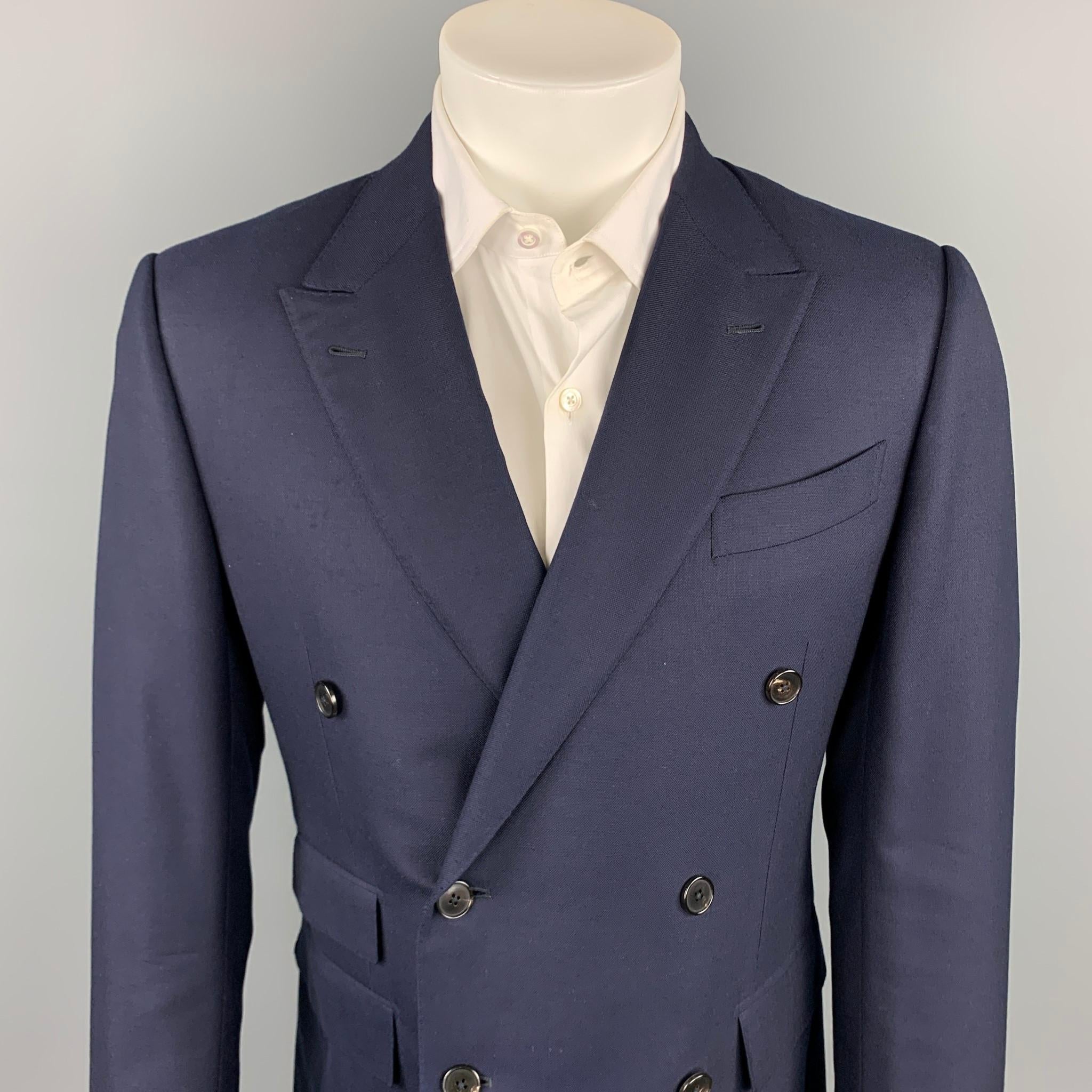 ERMENEGILDO ZEGNA custom sport coat comes in a navy wool with a full liner featuring a peak lapel, flap pockets, and a double breasted closure. Made in Italy.

Very Good Pre-Owned Condition.
Marked: 50 R

Measurements:

Shoulder: 17.5 in.
Chest: 38