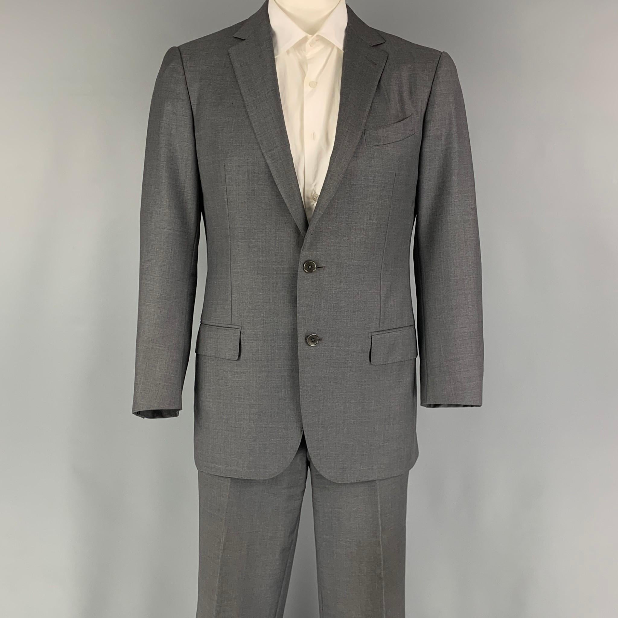 ERMENEGILDO ZEGNA suit comes in a grey wool woven material and includes a single breasted, double button sport coat with a notch lapel and matching flat front trousers.

Very Good Pre-Owned Condition.
Marked: 52 R

Measurements:

-Jacket
Shoulder: