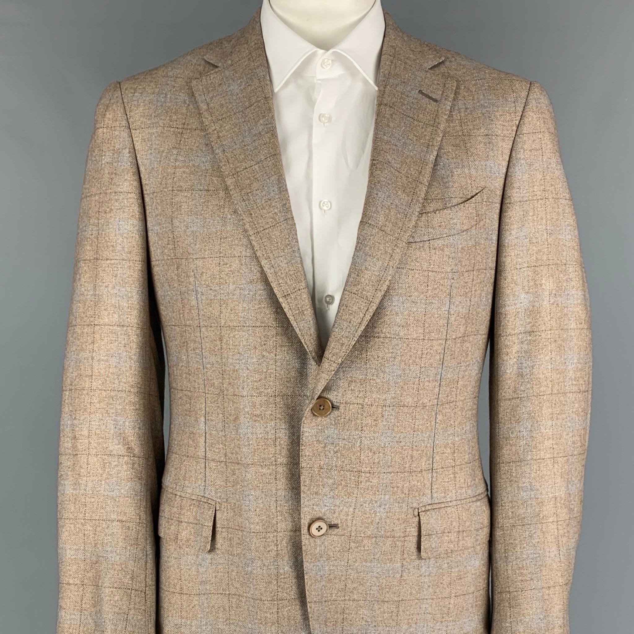 ERMENEGILDO ZEGNA sport coat comes in a oatmeal & light grey plaid silk / cashmere with a full liner featuring a notch lapel, flap pockets, double back vent, and a double button closure. 

Very Good Pre-Owned Condition.
Marked: 52