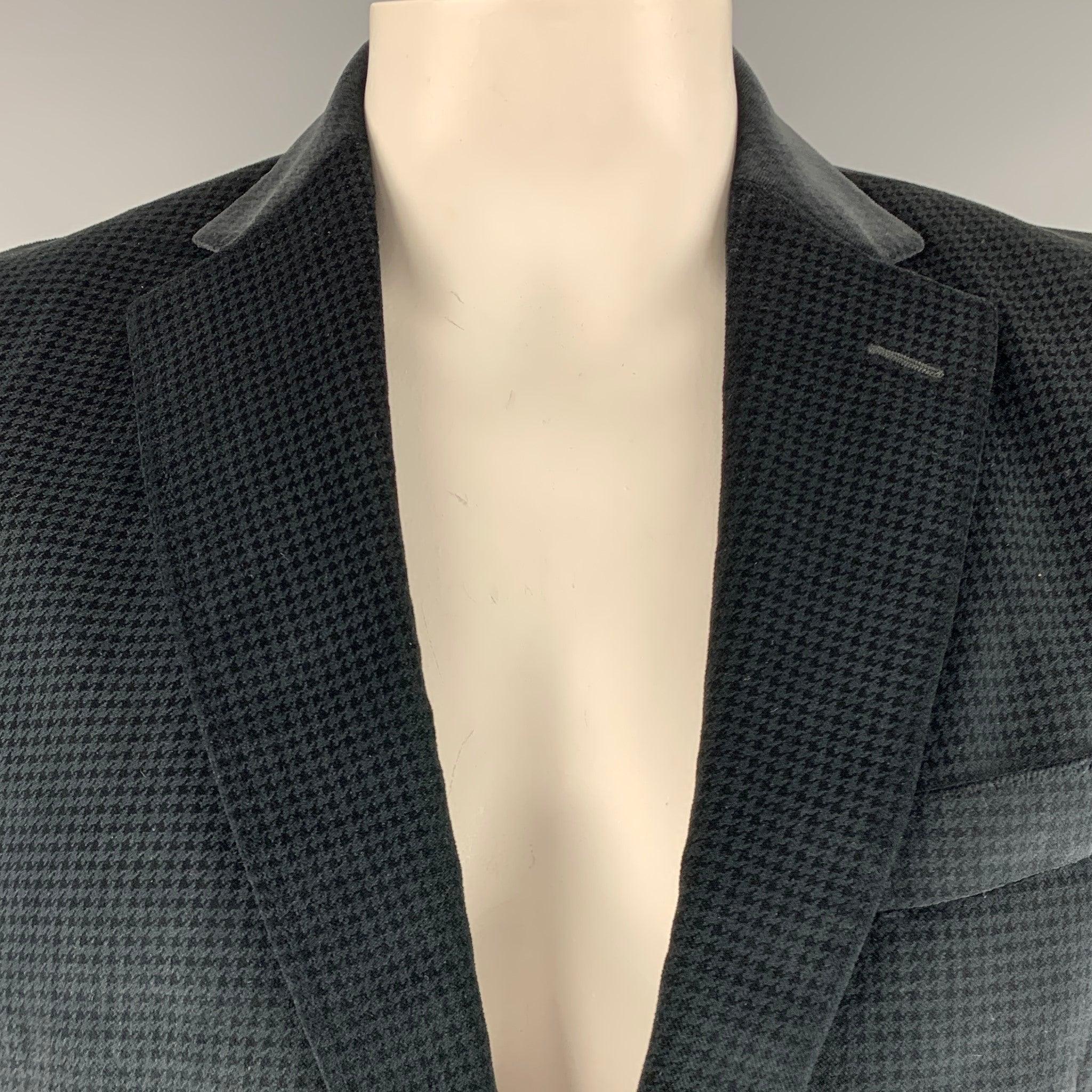 ERMENEGILDO ZEGNA sport coat
in a black cotton silk blend fabric featuring houndstooth pattern, notch lapel, double vented back, and double button closure. Made in Spainches Very Good Pre-Owned Condition. Minor mark on back. 

Marked:   54R