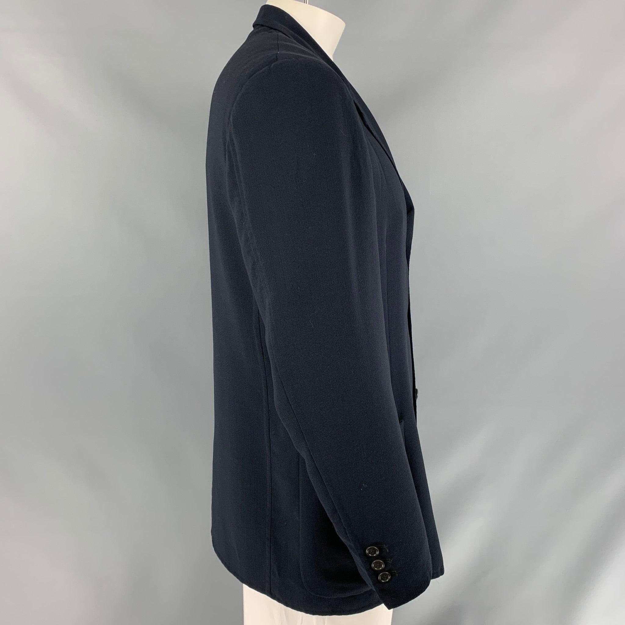 ERMENEGILDO ZEGNA soft sport coat comes in navy solid fabric, unlined featuring a notch lapel, patch pockets, and a three button closure. Excellent Pre-Owned Condition. Fabric Tag Removed. 

Marked:   No size Marked. 

Measurements: 
 
Shoulder: 19