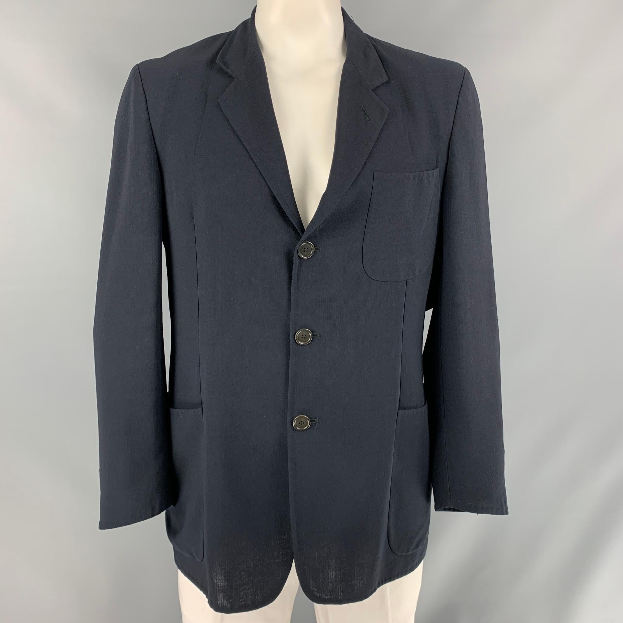 ERMENEGILDO ZEGNA soft sport coat comes in navy solid fabric, unlined featuring a notch lapel, patch pockets, and a three button closure.

Excellent Pre-Owned Condition. Fabric Tag Removed.
Marked: No size Marked.

Measurements:

Shoulder: 19