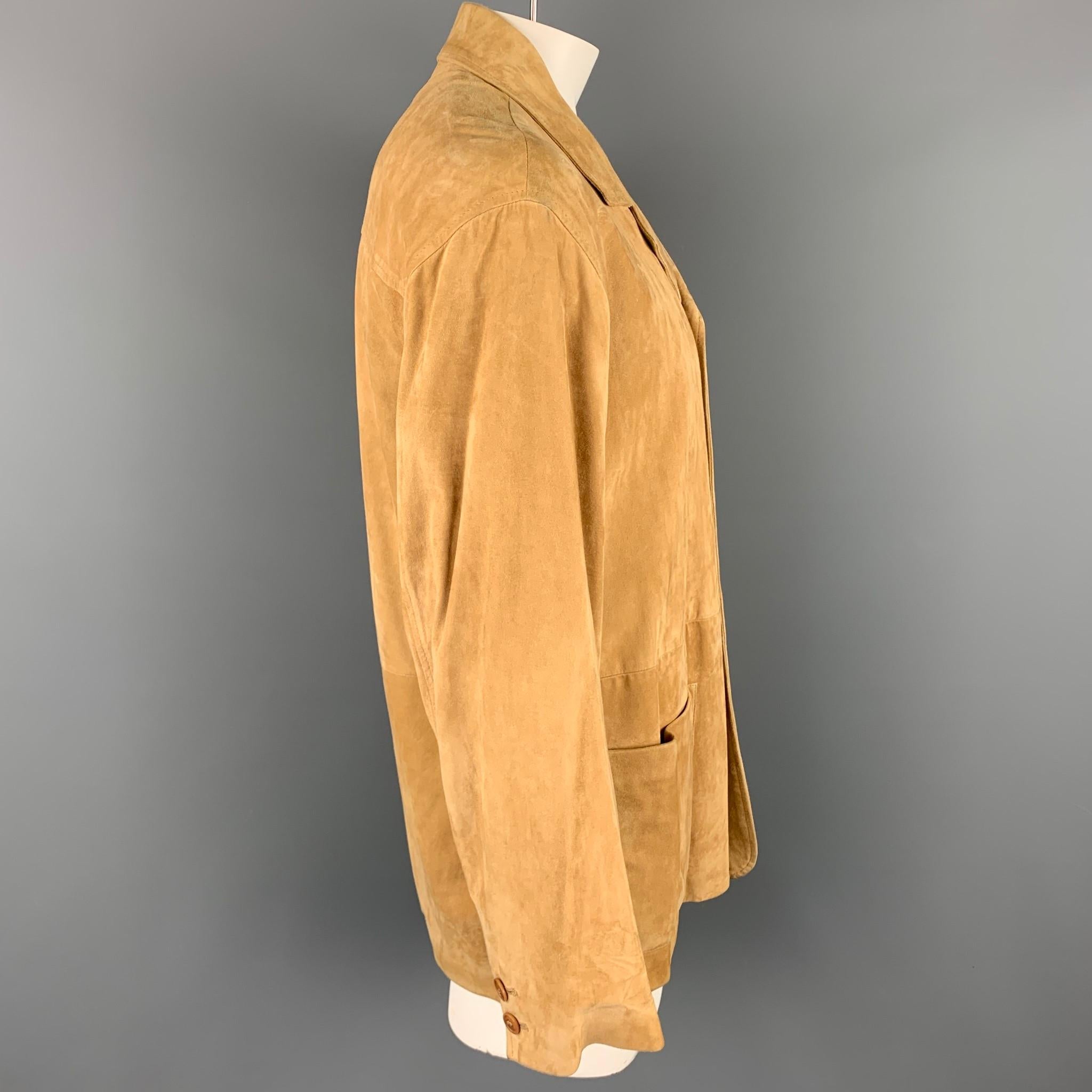 ERMENEGILDO ZEGNA jacket comes in a tan suede with a full liner featuring a notch lapel, patch pockets, and a buttoned closure. Made in Italy.

Very Good Pre-Owned Condition.
Marked: No fabric tag

Measurements:

Shoulder: 21 in.
Chest: 44