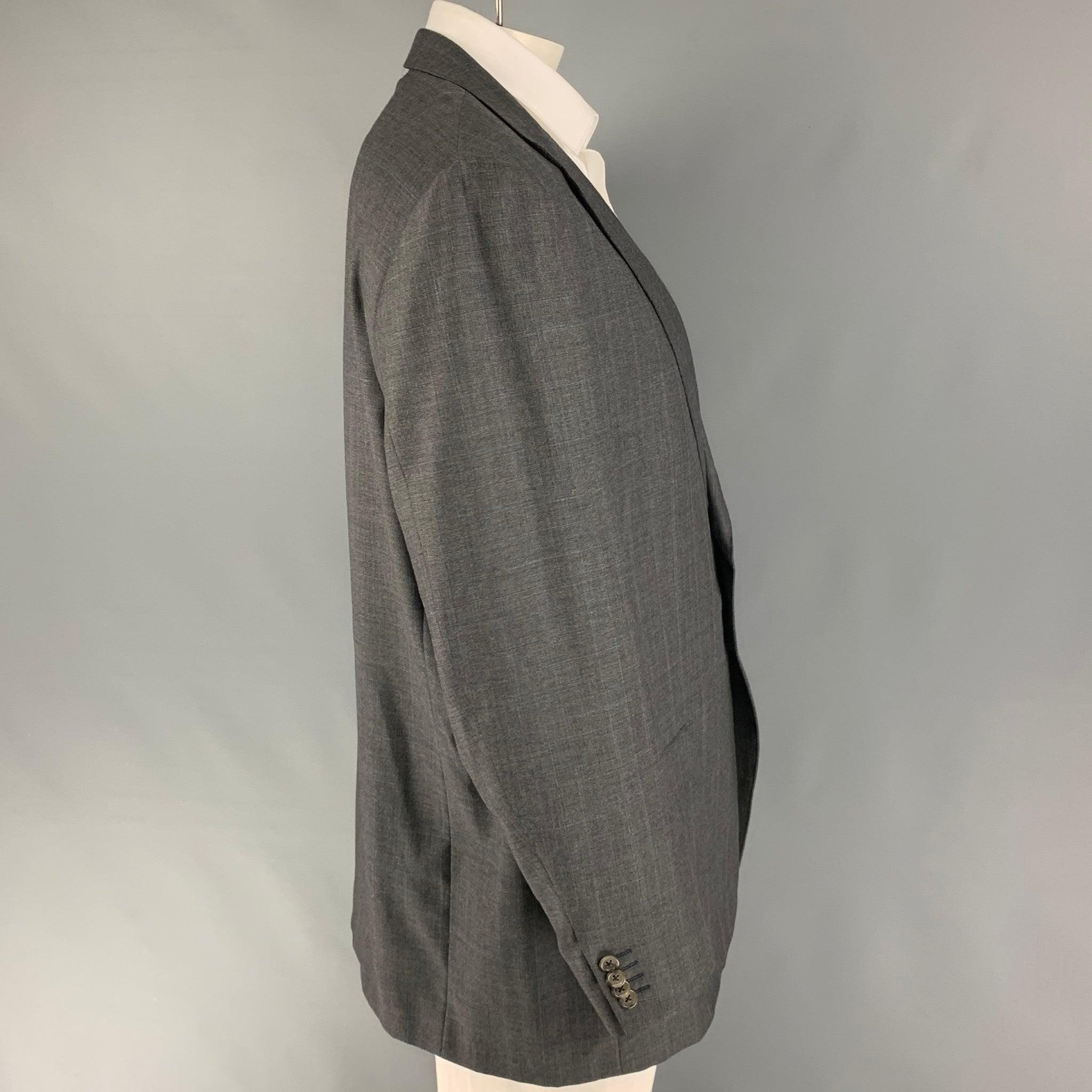 ERMENEGILDO ZEGNA
Ce manteau de sport est présenté dans un tissu de laine gris avec une doublure complète. Il présente un revers à cran, des poches à rabat et une fermeture à double bouton. Fabriquées en Italie. Très bon état d'origine. 

Marqué :  