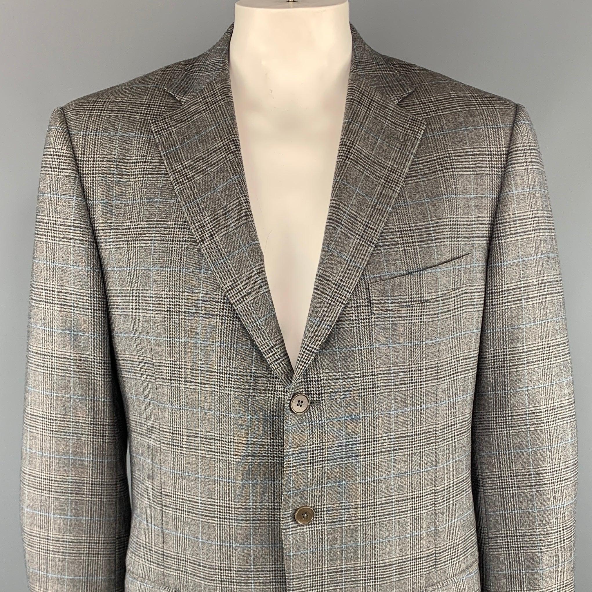ERMENEGILDO ZEGNA
sport coat comes in a gray plaid wool with a notch lapel, flap pockets, and a three button closure. Made in ItalyExcellent Pre-Owned Condition.
 

Marked:   IT 56 L
 

Measurements: 
 
Shoulder: 19 inches Chest: 40 inches 
Sleeve: