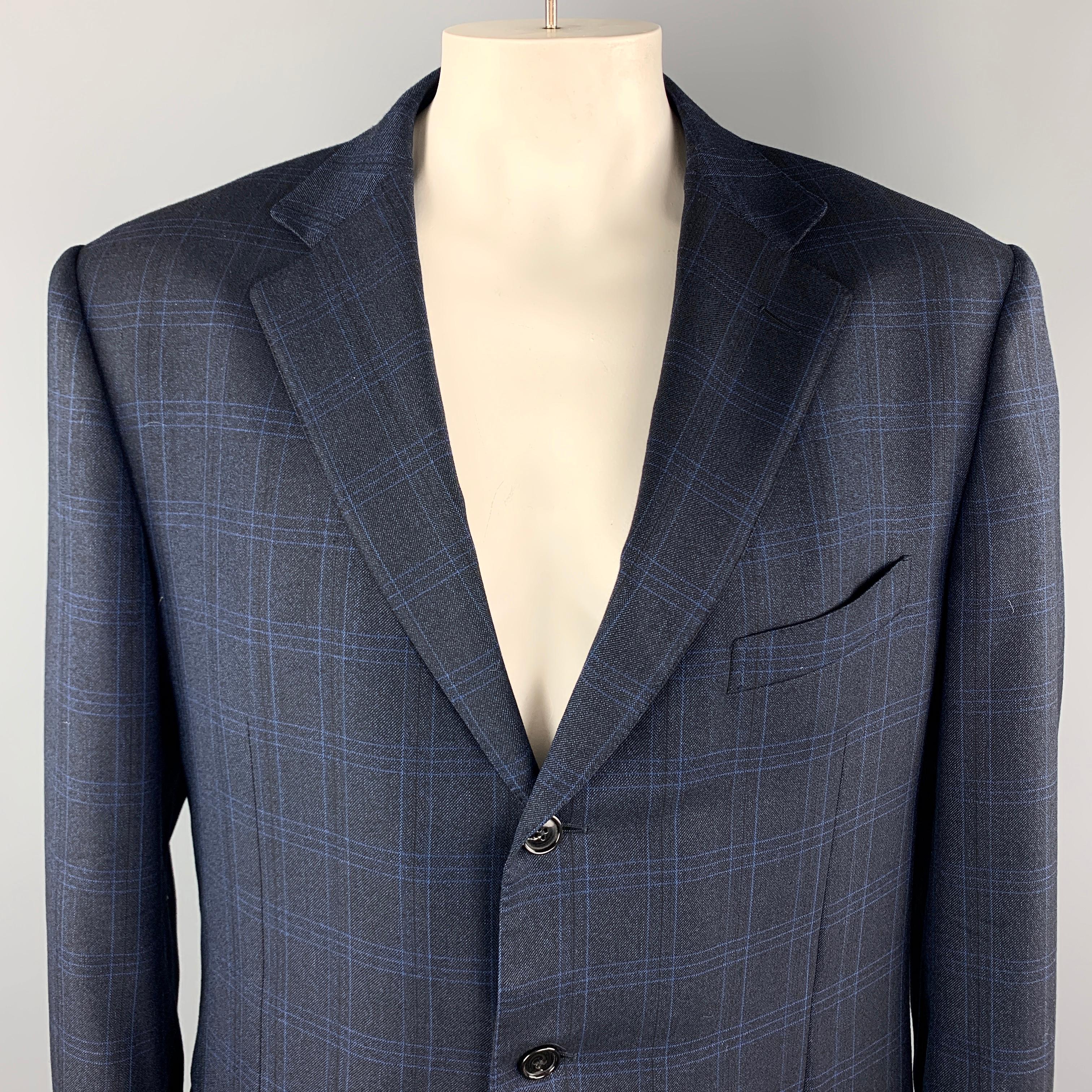ERMENEGILDO ZEGNA Long Sport Coat comes in a navy plaid wool material, with a notch lapel, slit and flap pockets, three buttons at closure, single breasted, buttoned cuffs, and a double vent at back. Made in Switzerland.

Excellent Pre-Owned