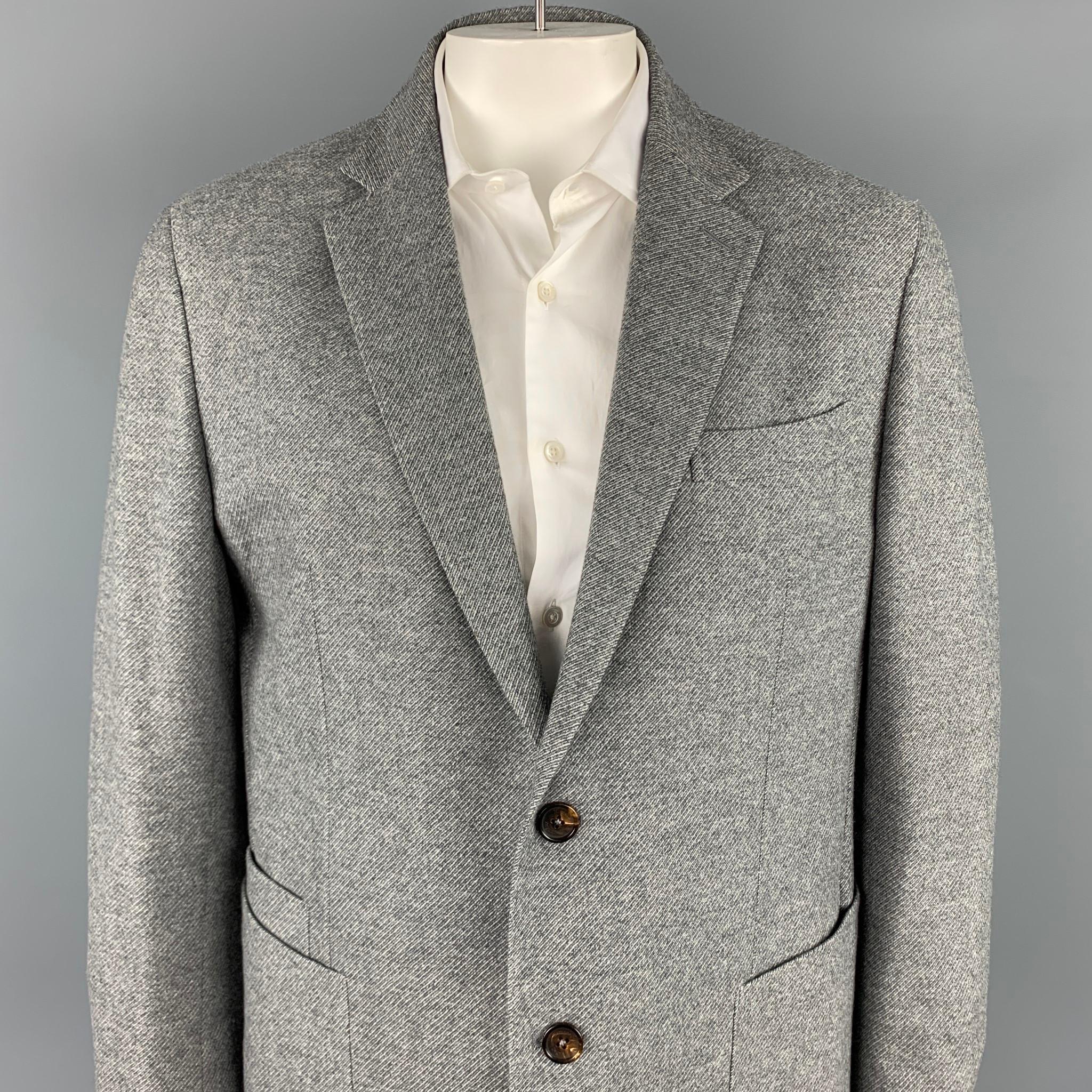 ERMENEGILDO ZEGNA sport coat comes in a grey heather wool / cashmere with a half liner featuring a notch lapel, patch pockets, and a two button closure. Made in Italy.

Very Good Pre-Owned Condition.
Marked: 58 R

Measurements:

Shoulder: 18.5
