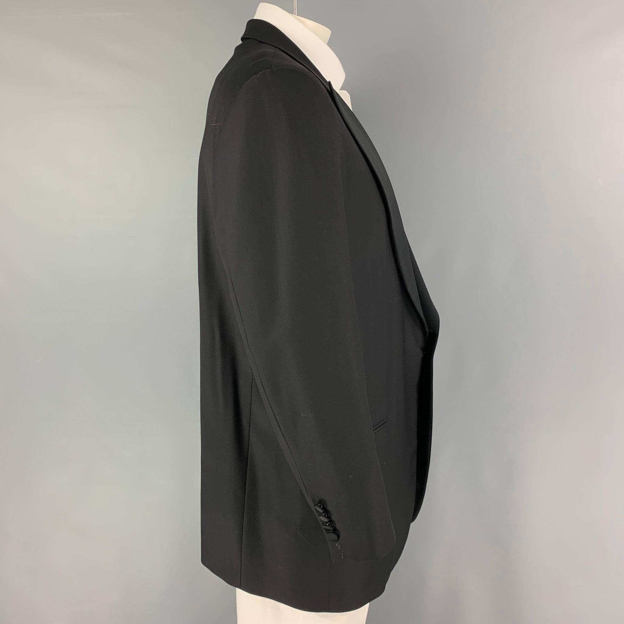 ERMENEGILDO ZEGNA sport coat comes in a black wool with a full liner featuring a peak lapel, slit pockets, and a single button closure.
Excellent
Pre-Owned Condition. 

Marked:   58 

Measurements: 
 
Shoulder: 19 inches Chest: 48 inches Sleeve: