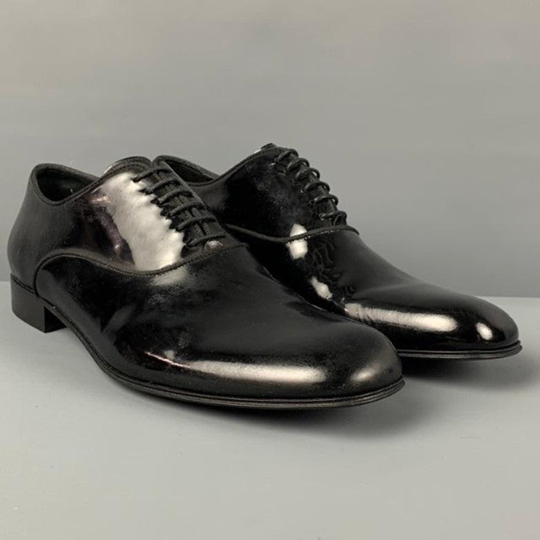 Les chaussures ERMENEGILDO Zegna sont en cuir verni noir et présentent un bout carré et une fermeture à lacets. Comprend une boîte. Fabriquées en Italie.
Bon
Etat d'occasion. 

Marqué :   7.5 EU / 8.5 USSemelle extérieure : 11.75 pouces  x 4 pouces