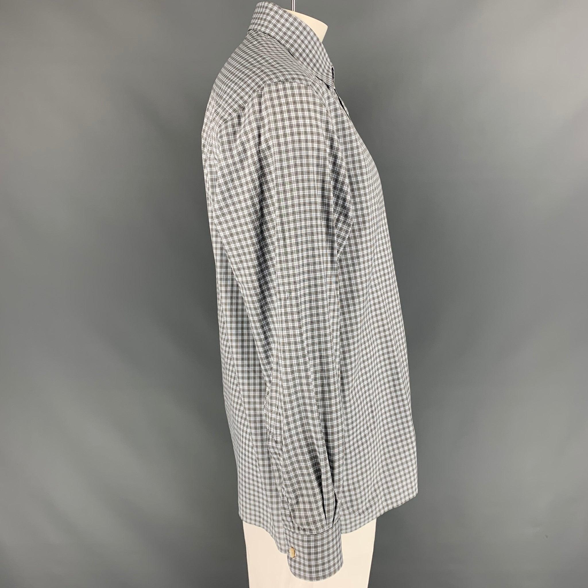 ERMENEGILDO ZEGNA long sleeve shirt comes in blue and brown plaid cotton featuring a patch pocket at left front panel, spread collar, one button round cuff, and button up closure. Very Good Pre-Owned Condition. 

Marked:   L 

Measurements: 
