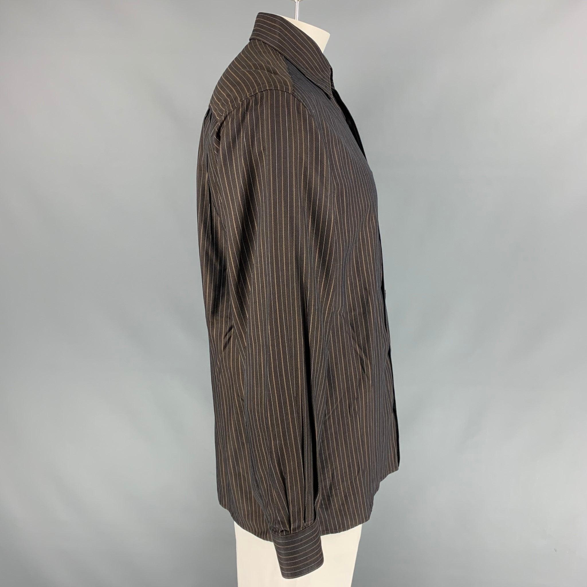 ERMENEGILDO ZEGNA Long sleeve shirt comes in brown striped cotton featuring a patch pocket at left front panel, hidden button down collar, one button round cuff, and button up closure. Made in Italy.Very Good Pre-Owned Condition. 

Marked:   L
