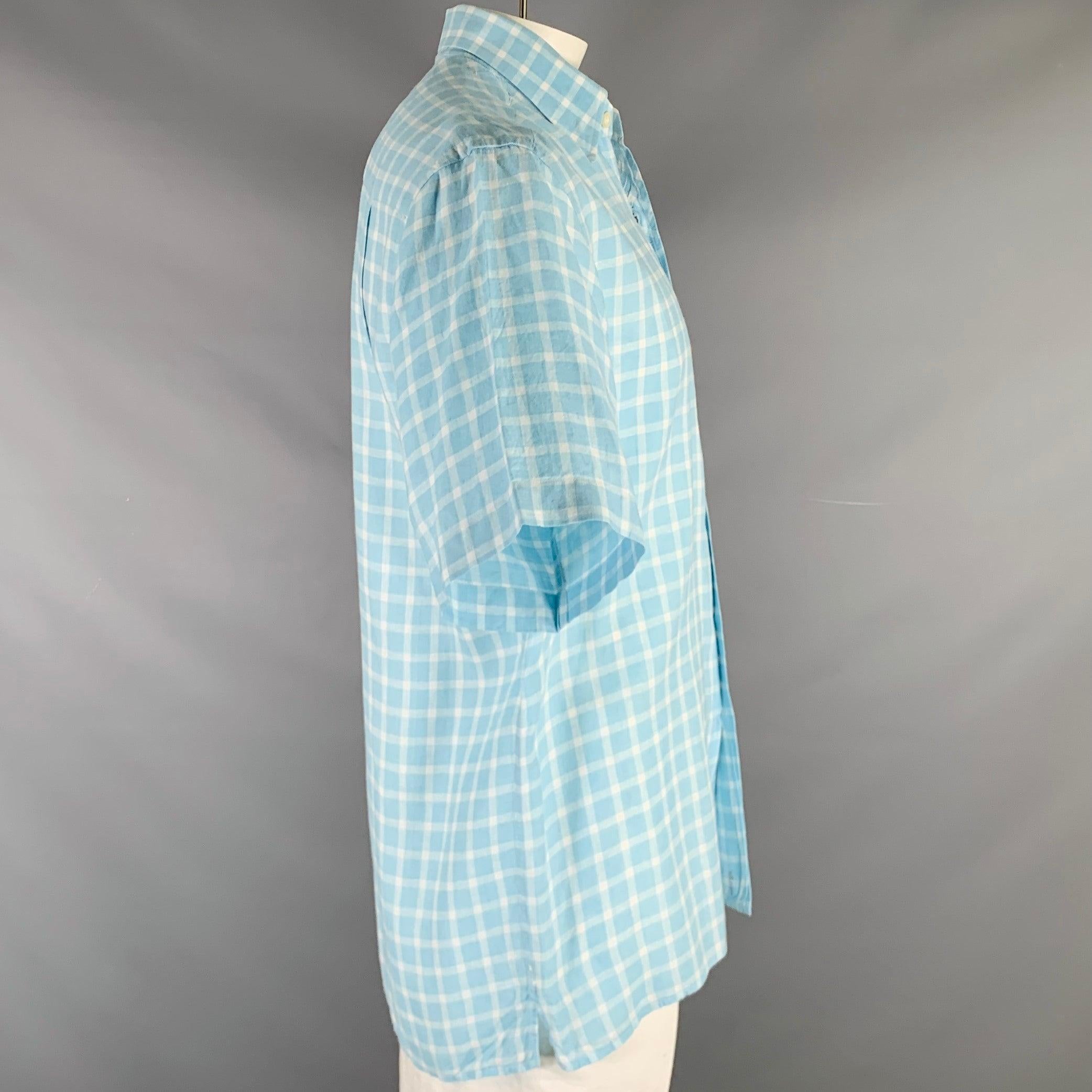 ERMENEGILDO ZEGNA short sleeve shirt in a light blue and white linen woven fabric featuring plaid pattern, spread collar, one pocket, and button closure. Made in Italy.Very Good Pre-Owned Condition. Minor signs of wear. 

Marked:   L 

Measurements: