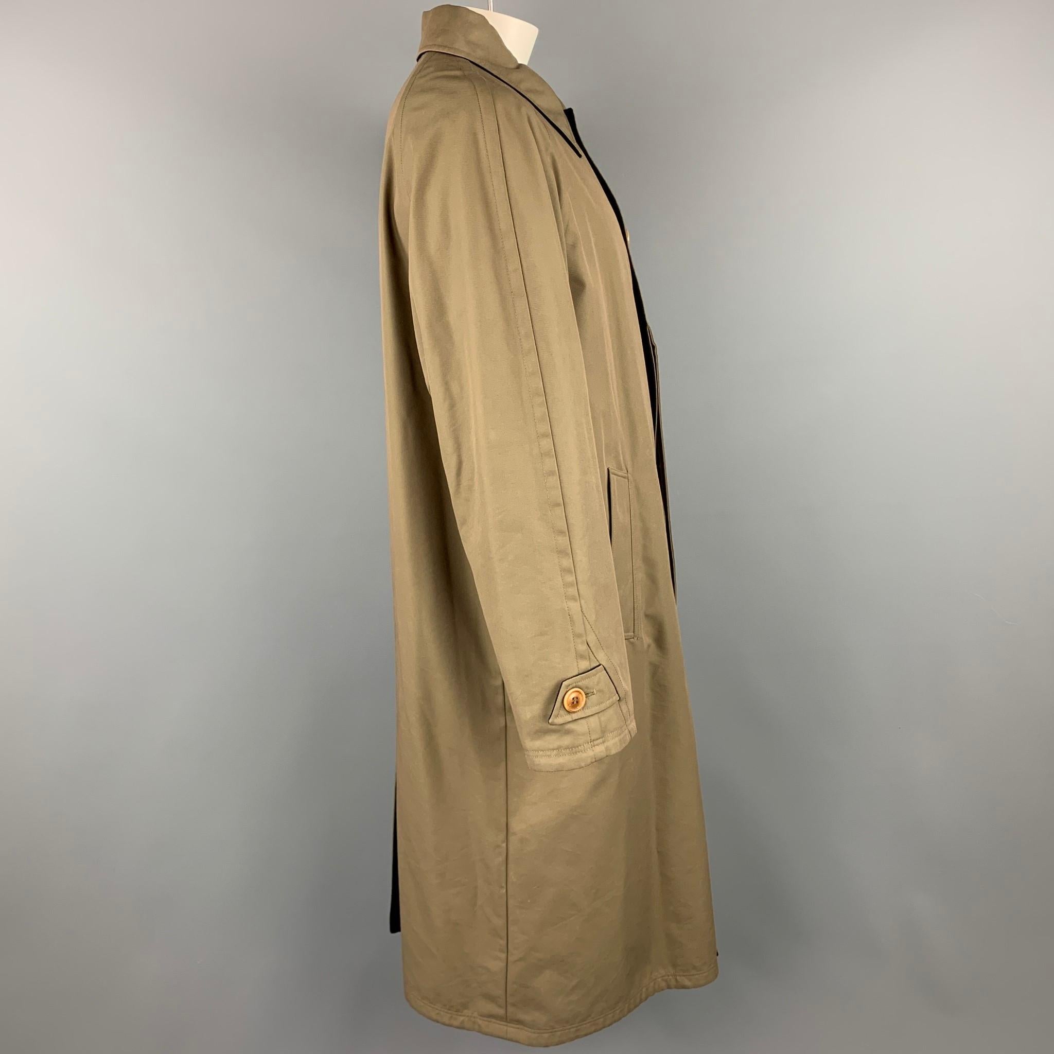 ERMENEGILDO ZEGNA coat comes in a olive & black wool blend featuring a reversible style, slit pockets, spread collar, and a hidden button closure. Moderate wear. Made in Italy.

Good Pre-Owned Condition.
Marked: L/52

Measurements:

Shoulder: 18.5