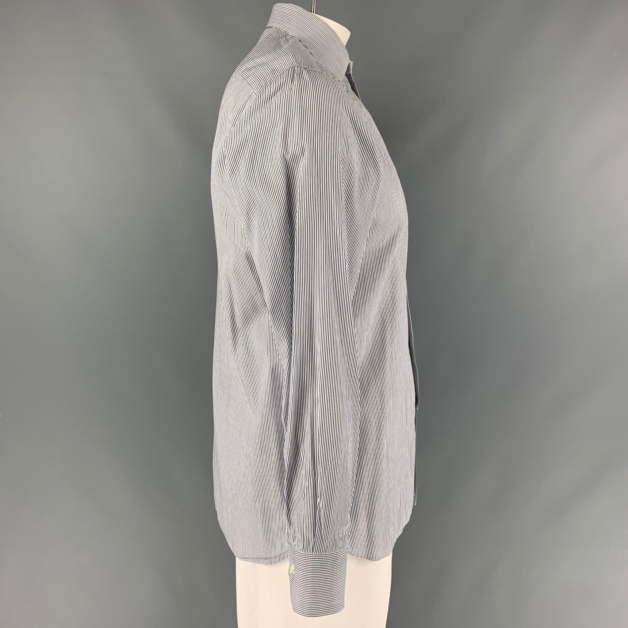 ERMENEGILDO ZEGNA Slim Fit long sleeve shirt comes in a black and white stripped cotton featuring a spread collar, and a button up closure. Very Good Pre-Owned Condition. 

Marked:   41/16 

Measurements: 
 
Shoulder: 19 inches Chest: 46 inches