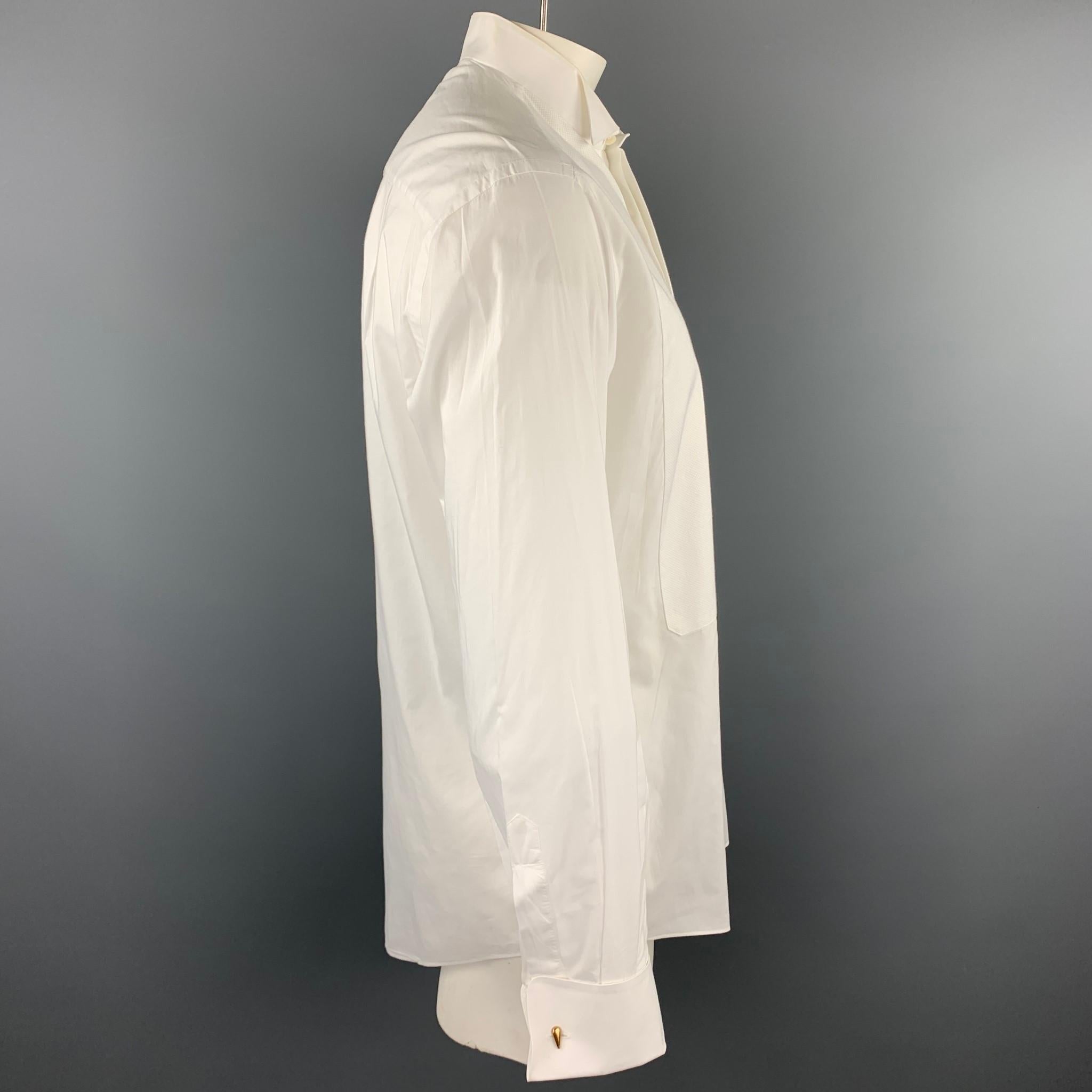 ERMENEGILDO ZEGNA long sleeve shirt comes in a white cotton featuring a tuxedo style, french cuffs, and a hidden button closure. Cuff links not included. Minor discoloration.

Good Pre-Owned Condition.
Marked: L

Measurements:

Shoulder: 19 in.