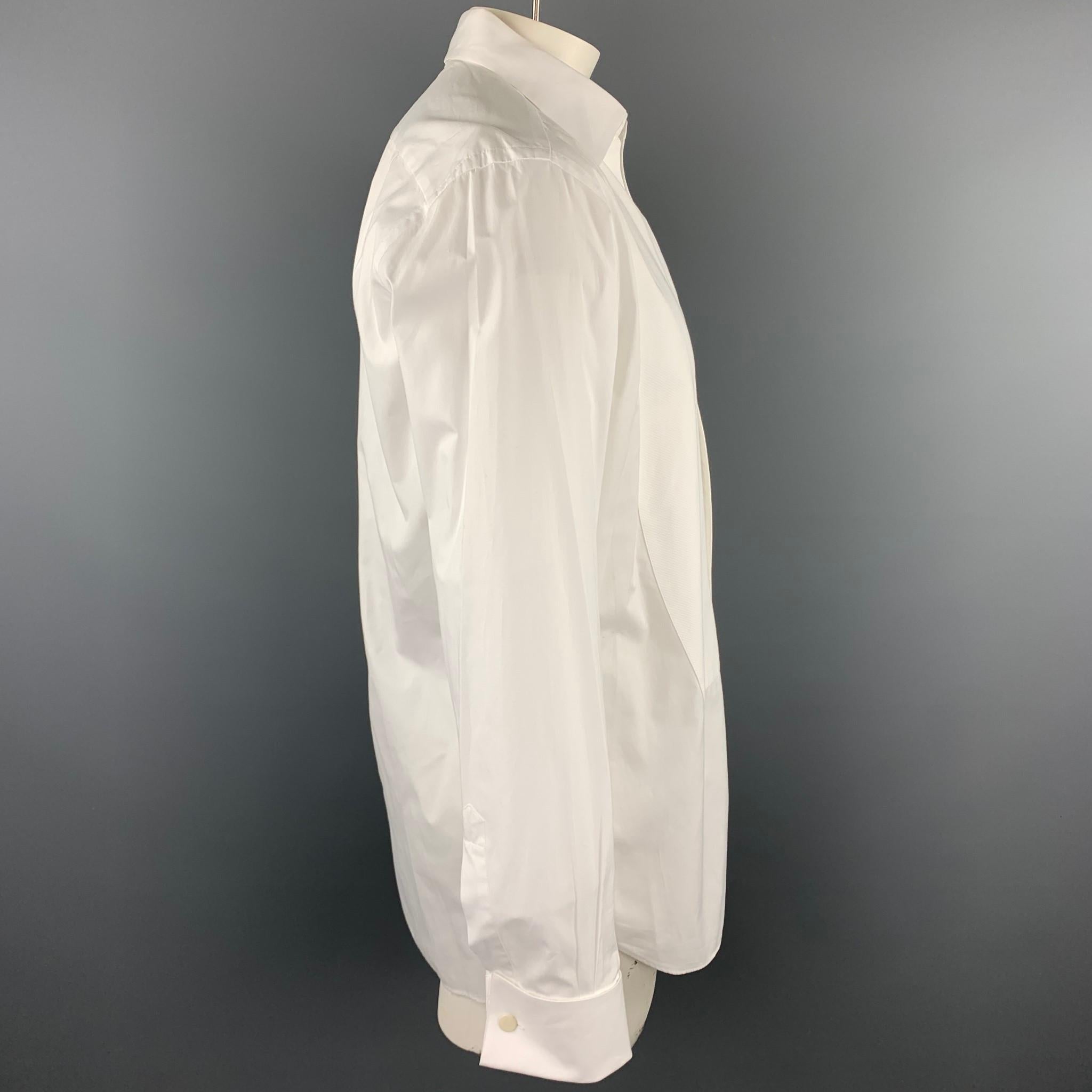 ERMENEGILDO ZEGNA long sleeve shirt comes in a white cotton featuring a tuxedo style and french cuffs. No buttons or cufflinks included. 

Good Pre-Owned Condition.
Marked: 42/16.5

Measurements:

Shoulder: 18.5 in. 
Chest: 42 in. 
Sleeve: 26.5 in.