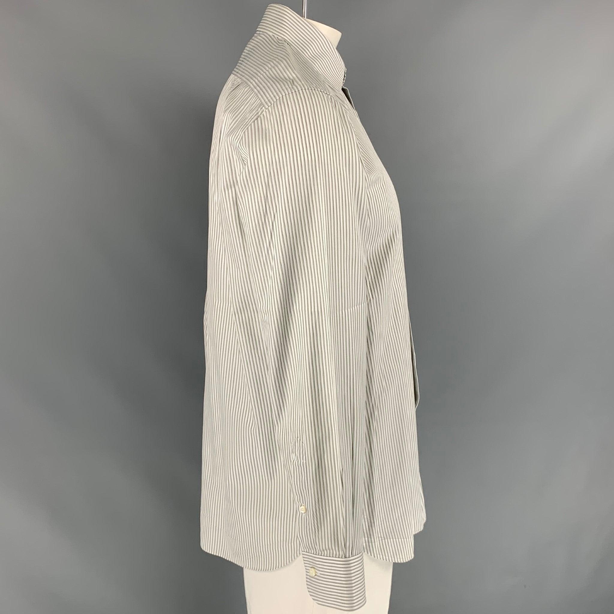 ERMENEGILDO ZEGNA 'Regular Fit' long sleeve shirt comes in white stripped cotton featuring a patch pocket at left front panel, spread collar, one button round cuff, and button up closure. Very Good Pre-Owned Condition. 

Marked:   41/16