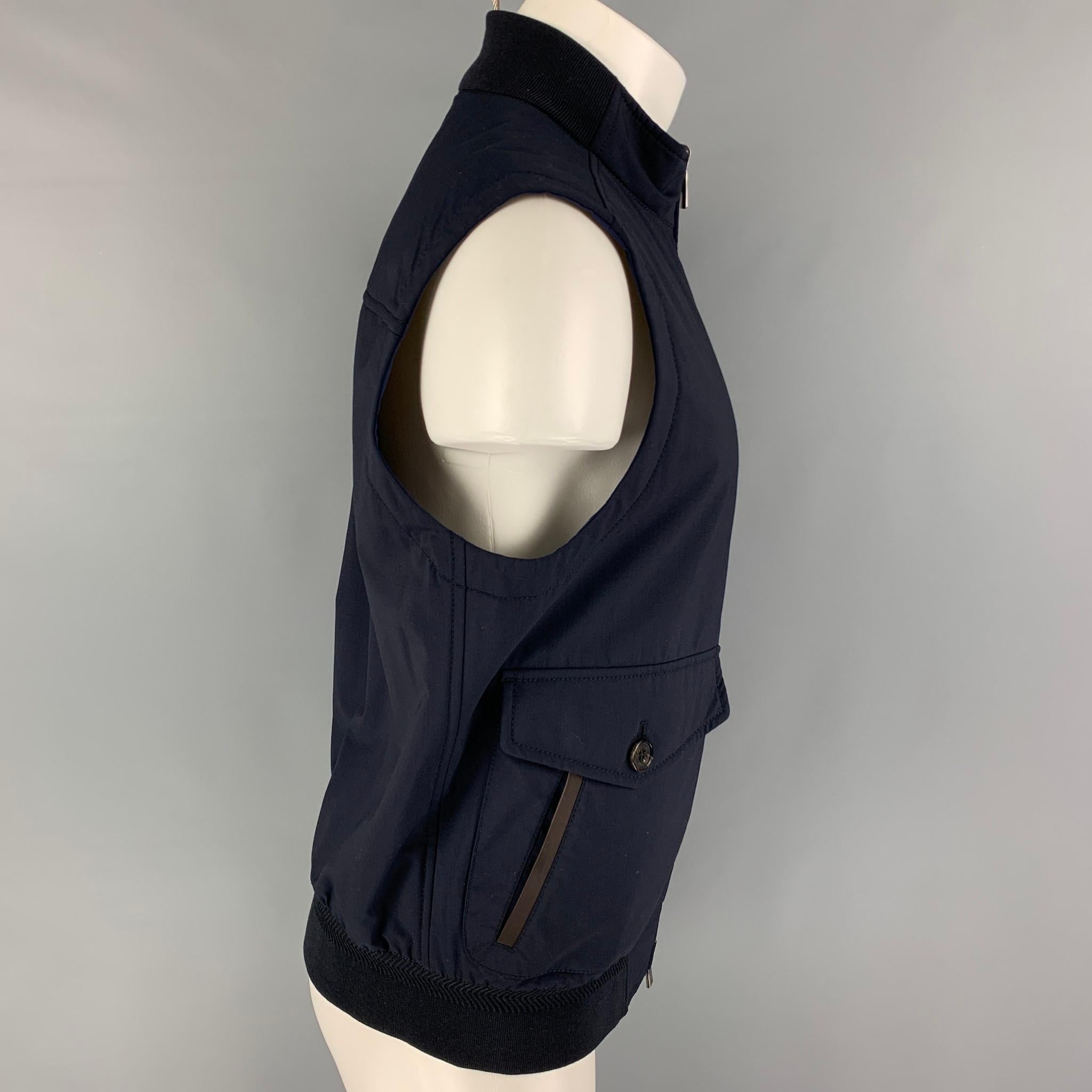 ERMENEGILDO ZEGNA vest comes in a blue wool / polyester featuring a reversible style, black ribbed hem, flap pockets, and a full zip up closure. Made in Italy. 

Excellent Pre-Owned Condition.
Marked: 50 R

Measurements:

Shoulder: 17.5 in.
Chest: