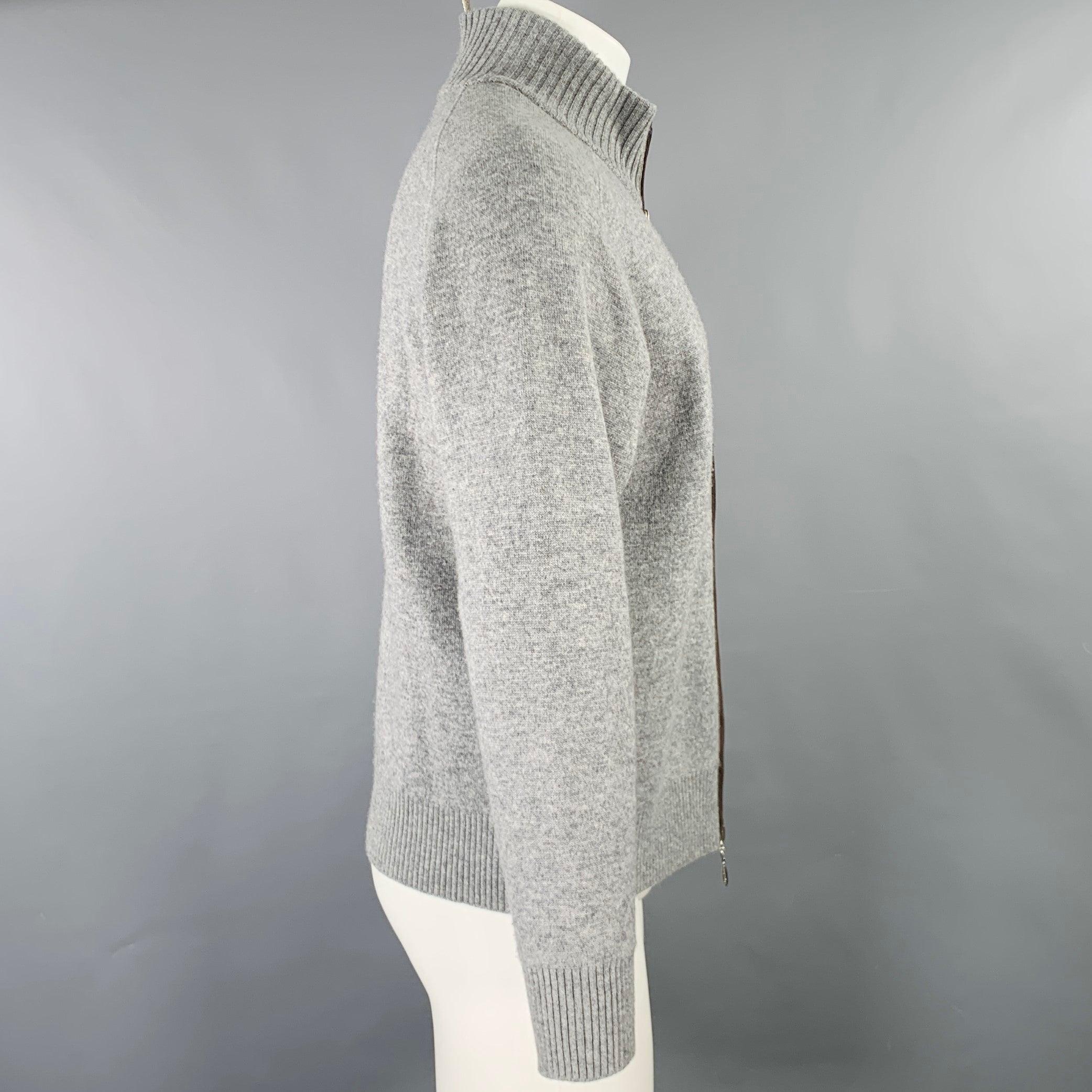 ERMENEGILDO ZEGNA cardigan
in a grey cashmere knit featuring brown suede zipper trim, and zip up closure. Made in Italy.Excellent Pre-Owned Condition. 

Marked:   M/50 

Measurements: 
 
Shoulder: 17.5 inches Chest: 43 inches Sleeve: 23.5 inches