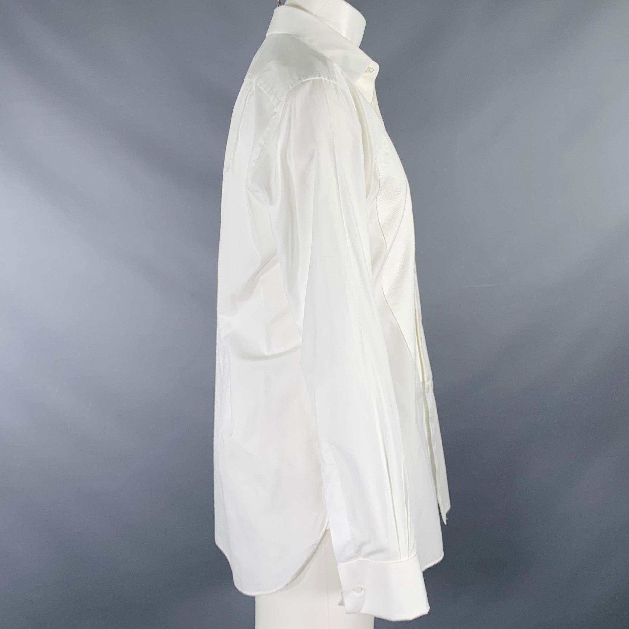 ERMENEGILDO ZEGNA long sleeve shirt
in a white cotton woven fabric featuring a textured bib front, French cuffs, and button & stud closure. Comes with set of basic tuxedo studs.Excellent Pre-Owned Condition. 

Marked:   41/16 

Measurements: 
