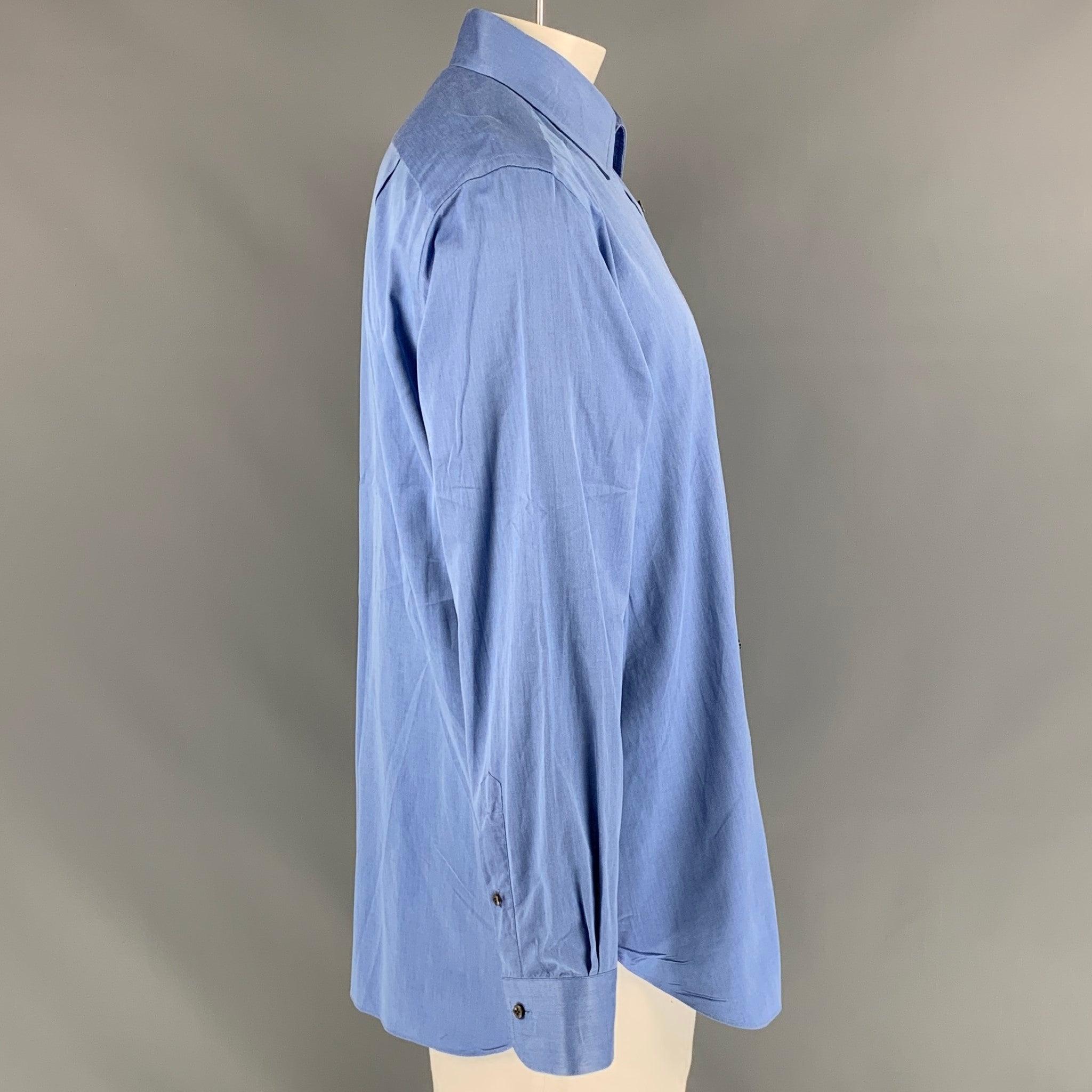 ERMENEGILDO ZEGNA Regular Fit long sleeve shirt comes in blue cotton featuring a patch pocket at left front panel, straight collar, one button round cuff, and button up closure. Very Good Pre-Owned Condition. Minor mark at the back. 

Marked:   44/