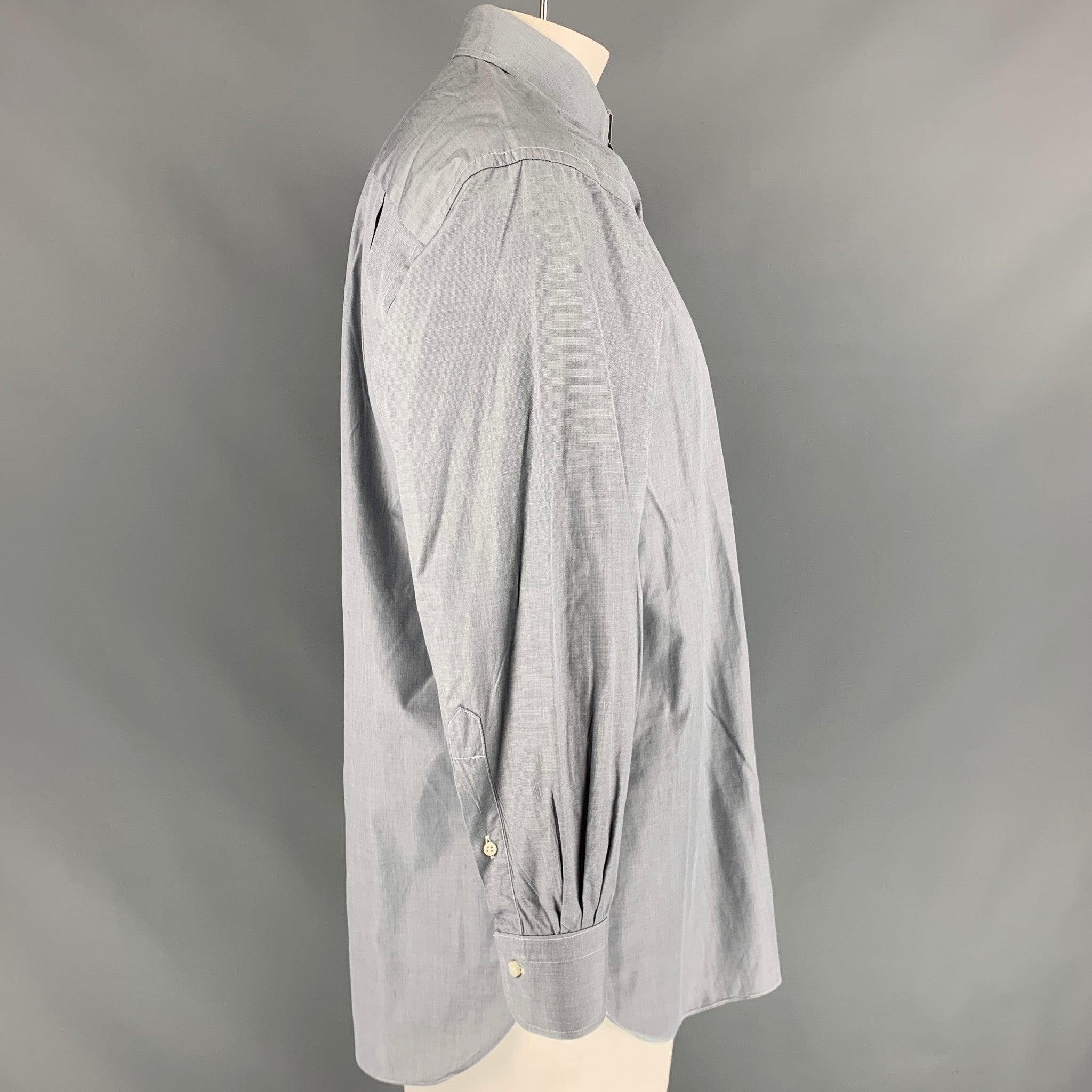 ERMENEGILDO ZEGNA 'Portofino Comfort' long sleeve shirt comes in grey cotton featuring a patch pocket at left front panel, spread collar, one button round cuff, and button up closure. Very Good Pre-Owned Condition. 

Marked:   43/17 

Measurements: