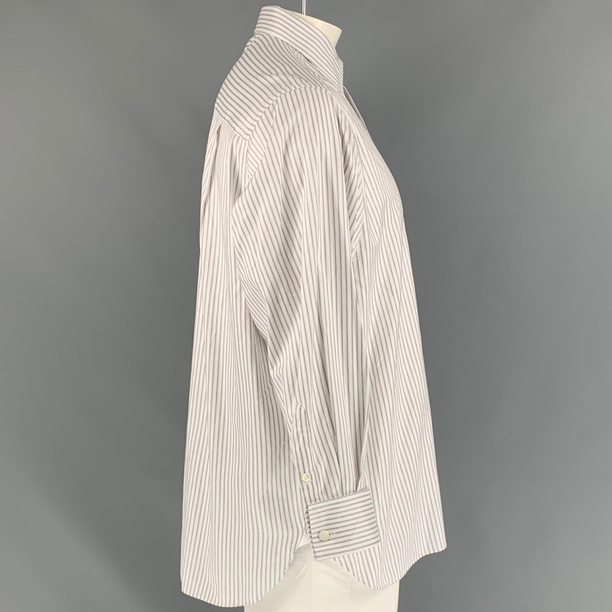 ERMENEGILDO ZEGNA 'Comfort Fit' long sleeve shirt comes in white stripped fabric featuring a patch pocket at left front panel, spread collar, french square cuff, and button up closure. Made in Spainches Very Good Pre-Owned Condition. 

Marked:   no