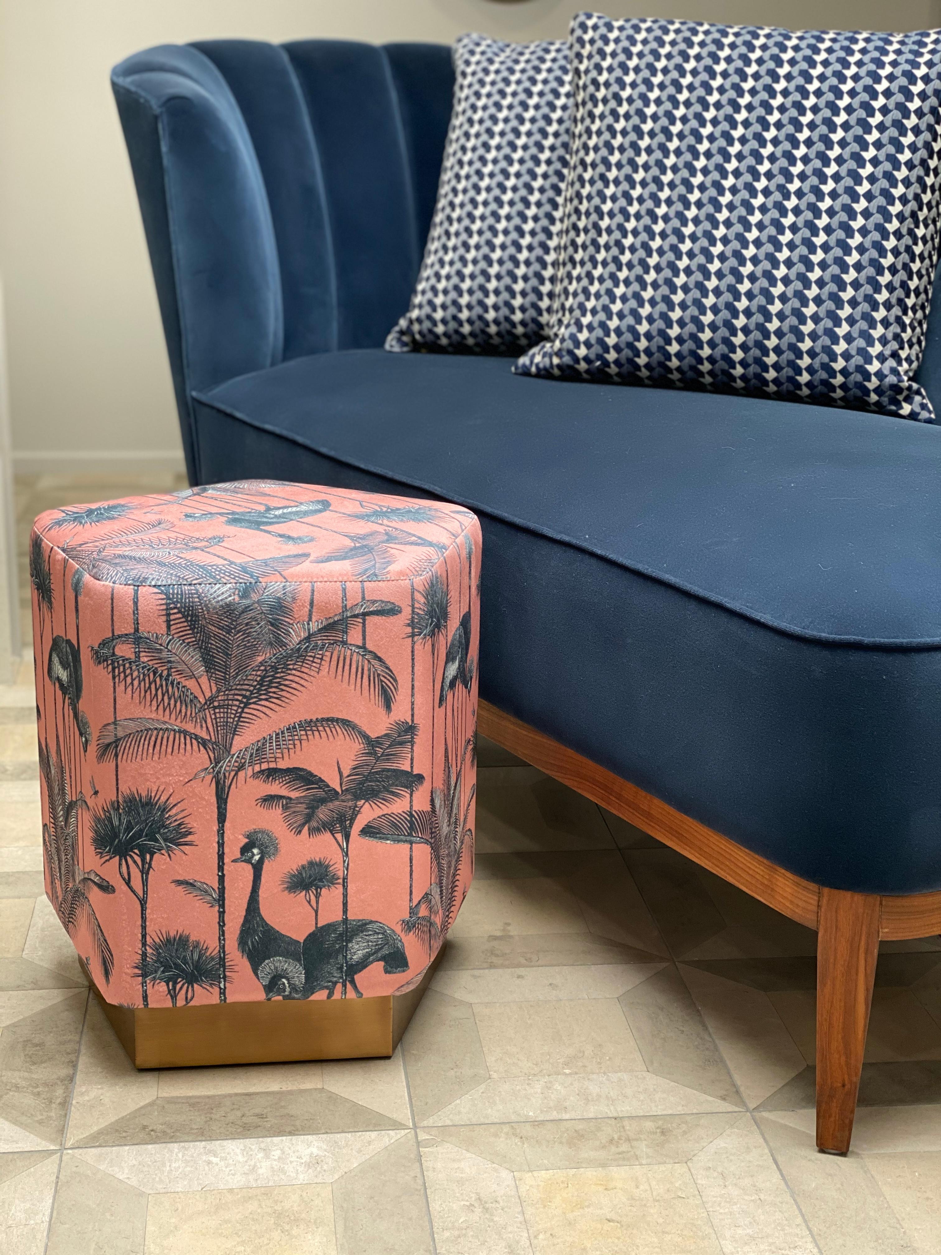 Introducing the Ermes Pouf from Casa Botelho - a funky and functional addition to any room! This pentagon-shaped pouf is a perfect balance of visual intrigue and versatility. Available in a range of colorful and textured fabrics, as well as metallic