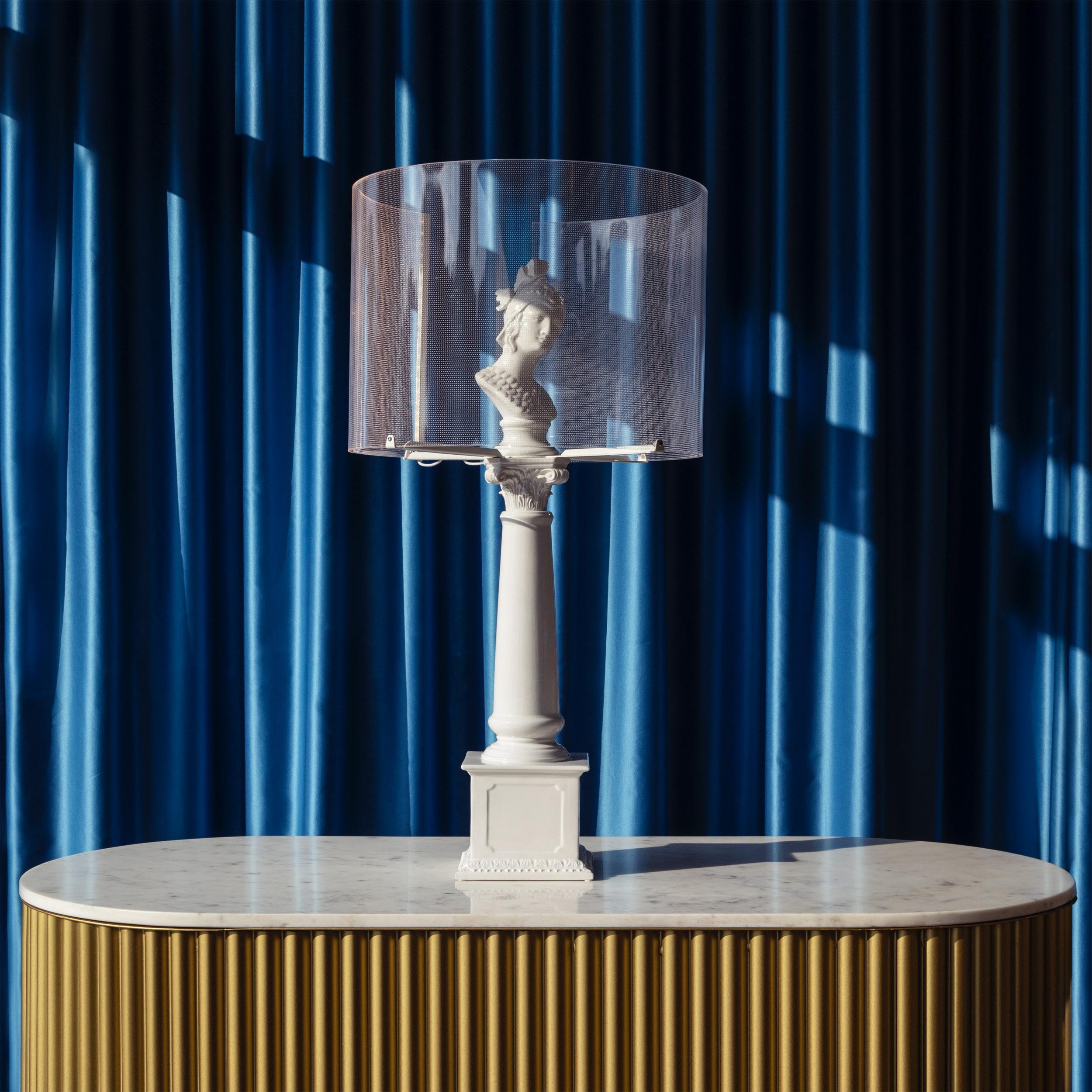 A sophisticated table lamp that will appeal to lovers of both Classical décor and contemporary style. The sculptural body – a bust of the god Hermes atop a column-shaped pedestal, is crafted from high-quality ceramic in the Venetian tradition,
