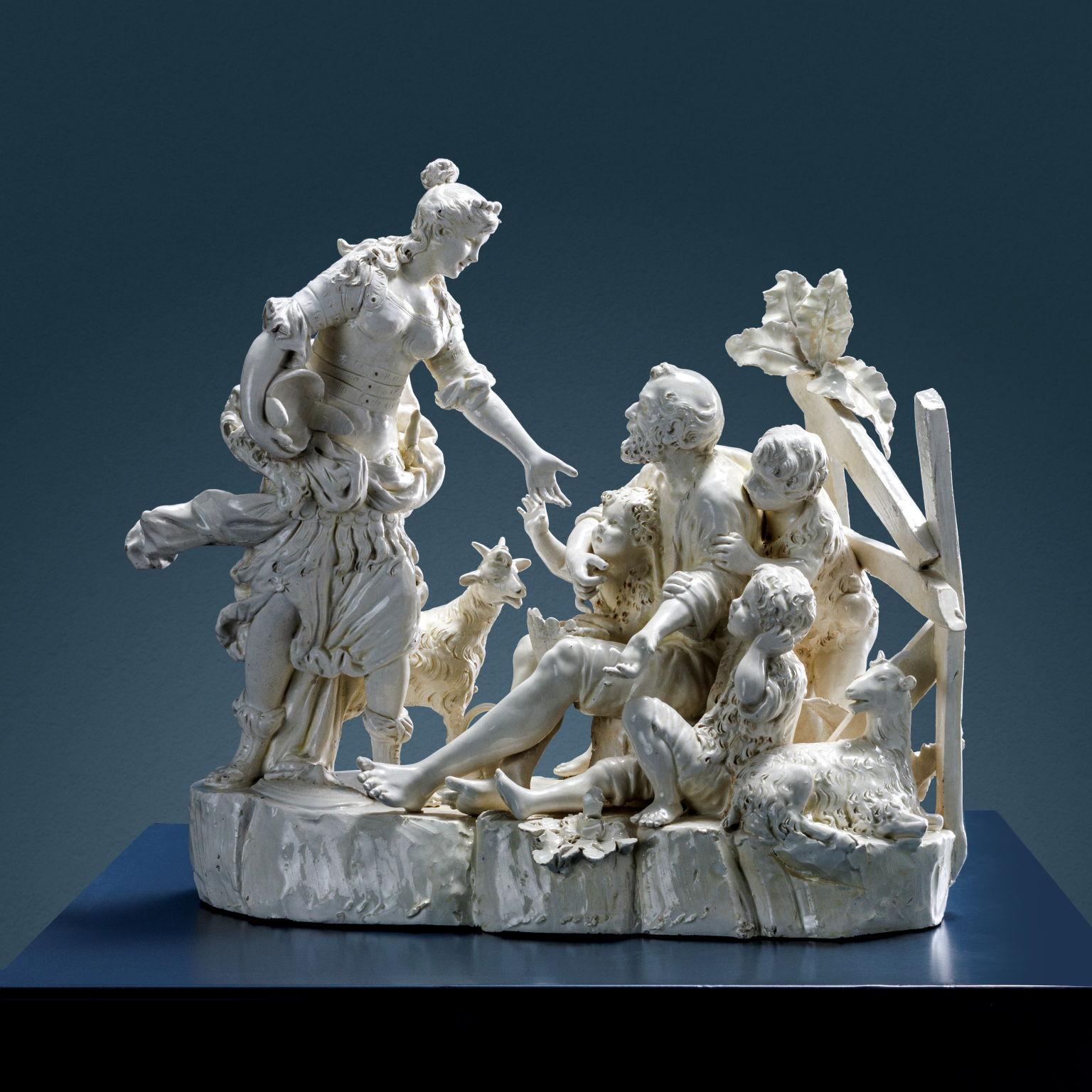 White glazed ceramic depicting Erminia among shepherds. Erminia is shown from the side, standing with her robe in the wind, helmet under her arm, and shield at her feet; she is stretched toward the shepherd seated on a log as he weaves a basket with