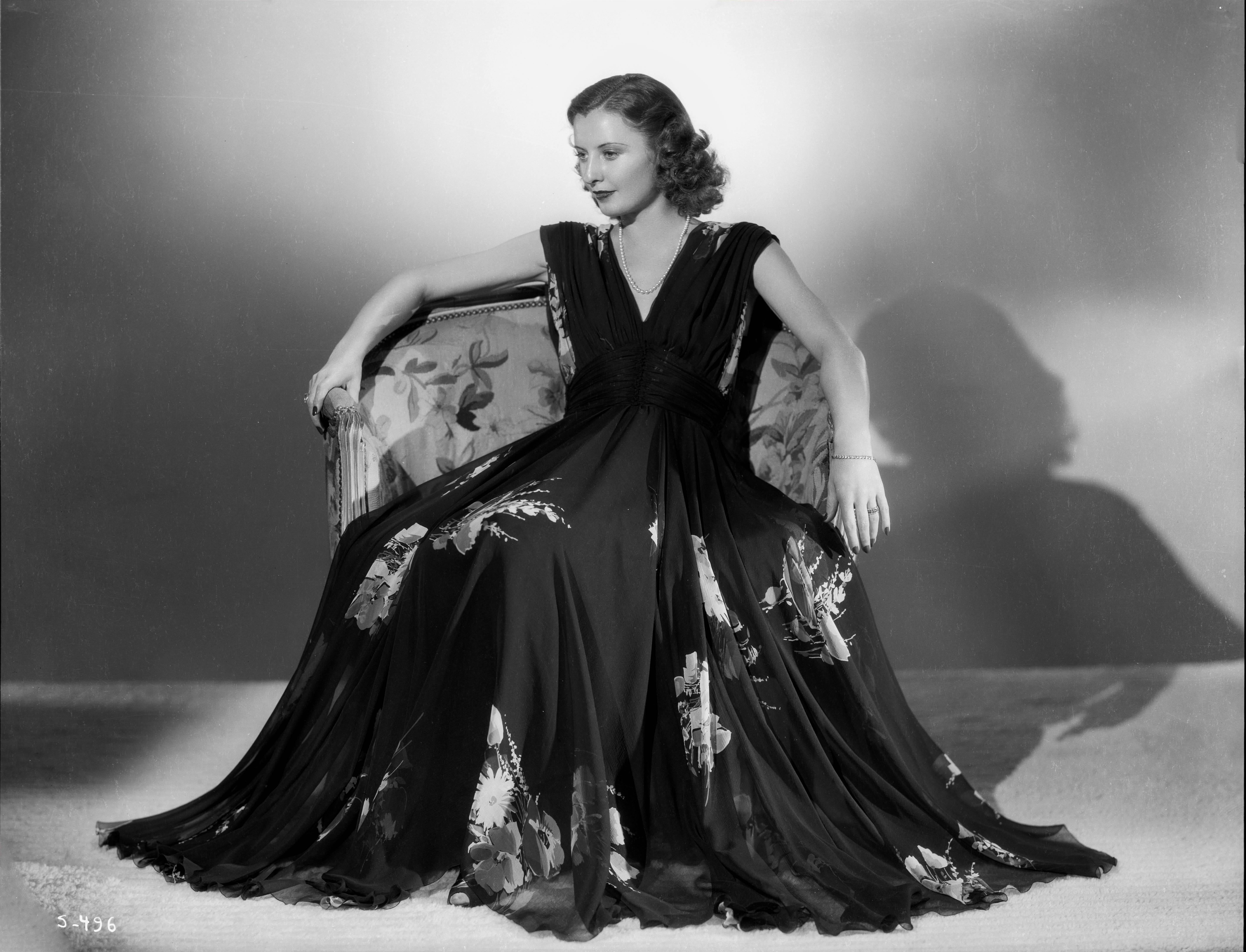 Ernest Bachrach Portrait Photograph - Barbara Stanwyck Posed on Chair Fine Art Print