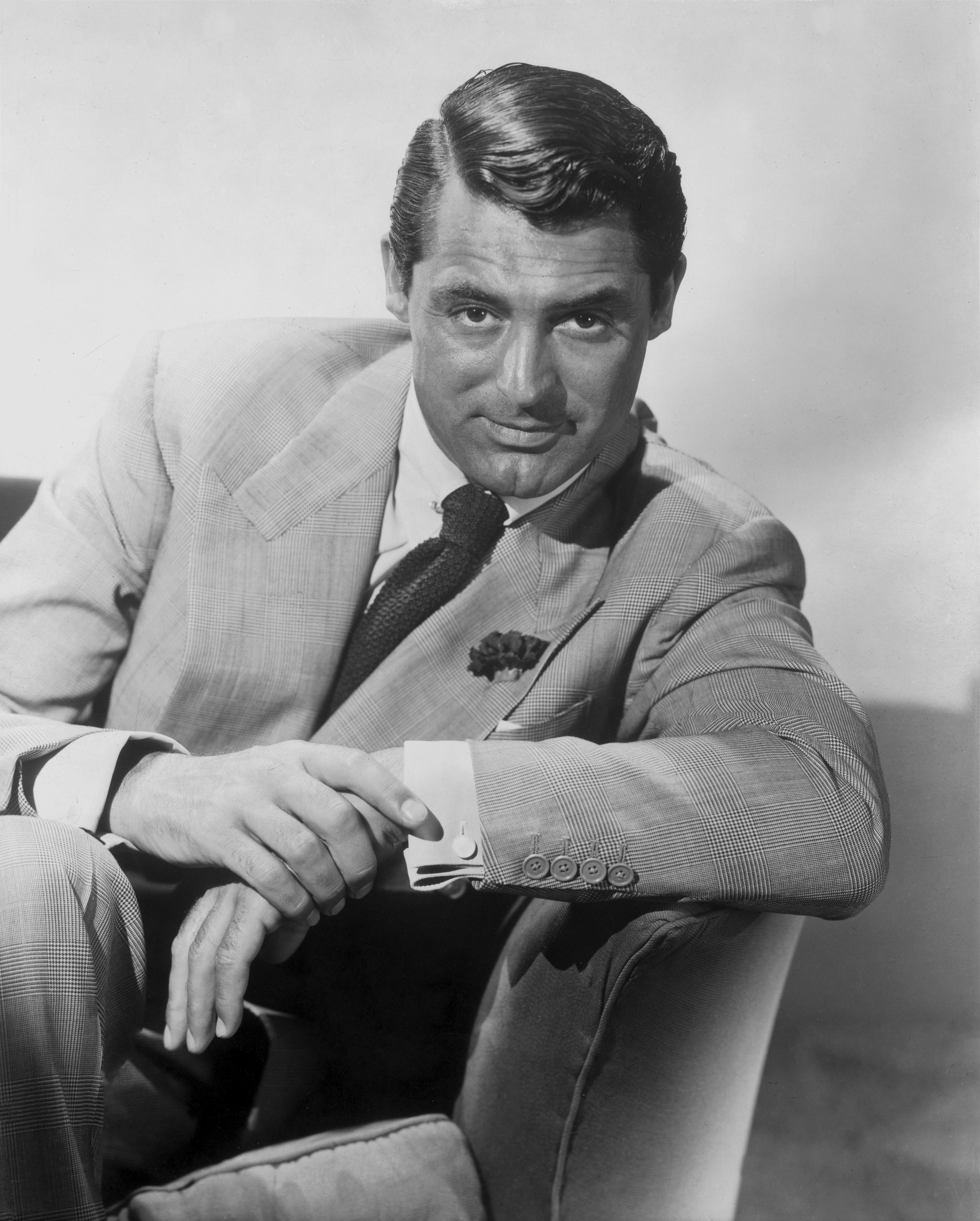 Ernest Bachrach Portrait Photograph - Cary Grant Leaning and Smiling in the Studio Movie Star News Fine Art Print