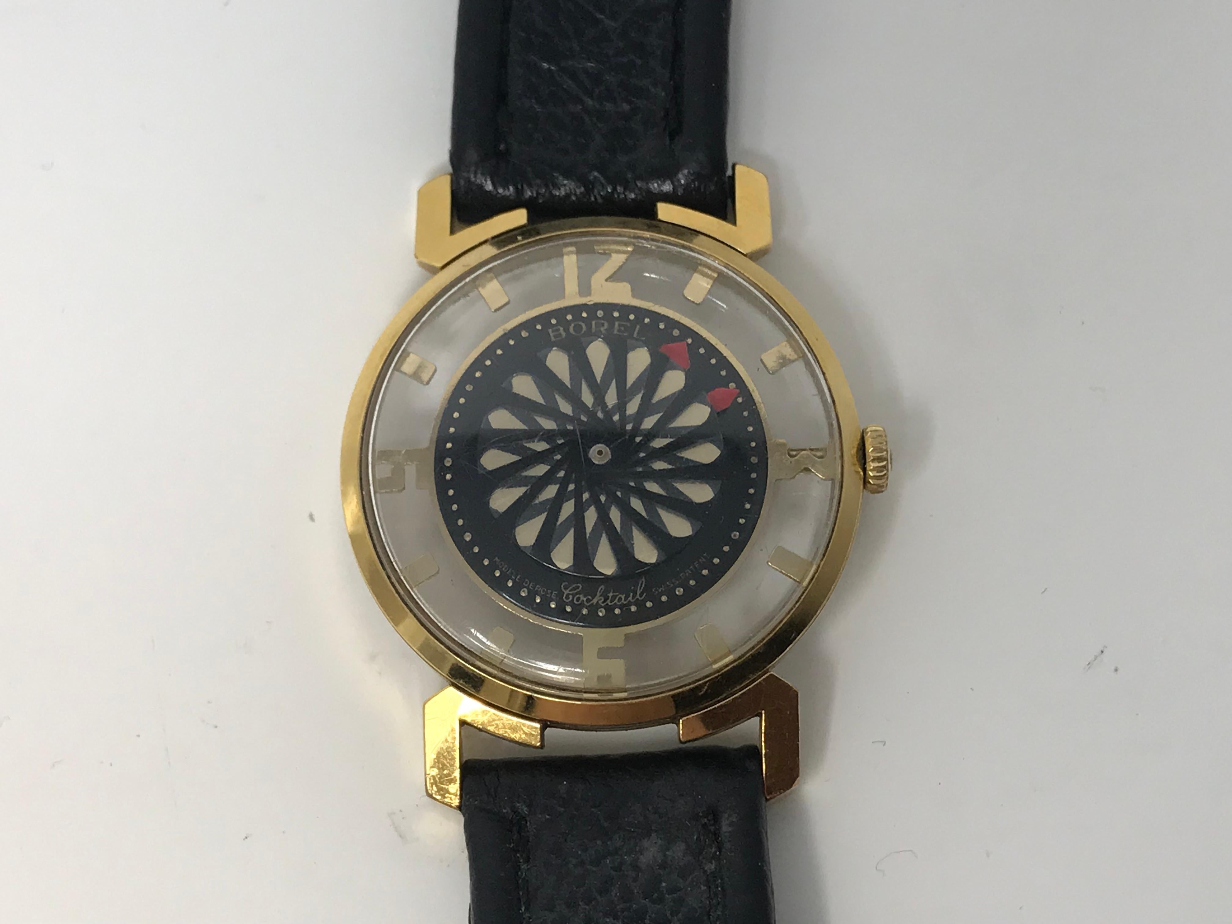 Ernest  Borel Kaleidoscope mechanical cocktail men's watch 17 jewel gold-plated with black leather strap (used). Very good working order , very minor surface scratches on the glass.