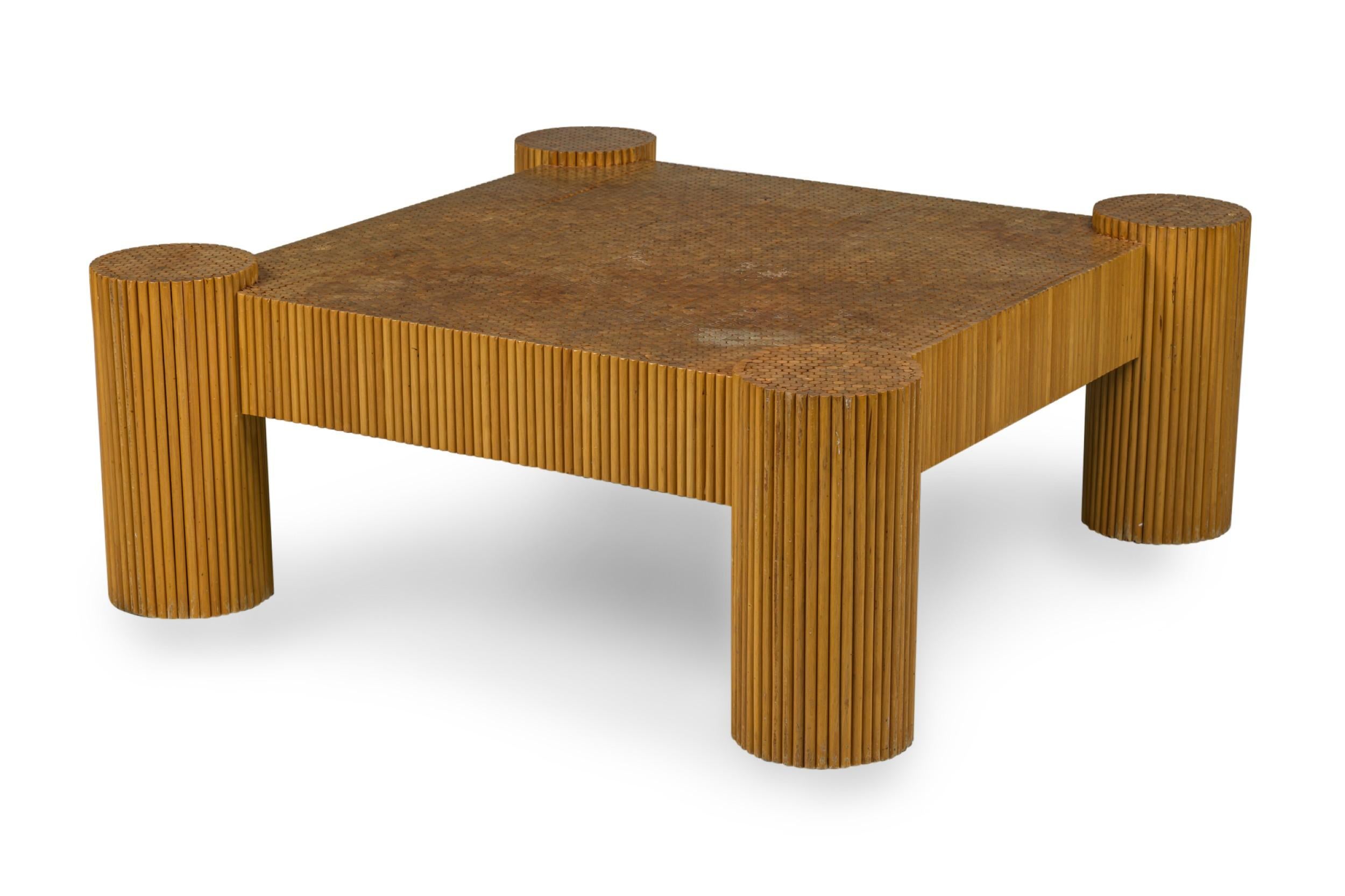 American Mid-Century Modern coffee table with square top and four exterior cylindrical legs comprised of bonded bamboo dowels. (ERNEST C. MASI)
 

 Minor wear to finish.
