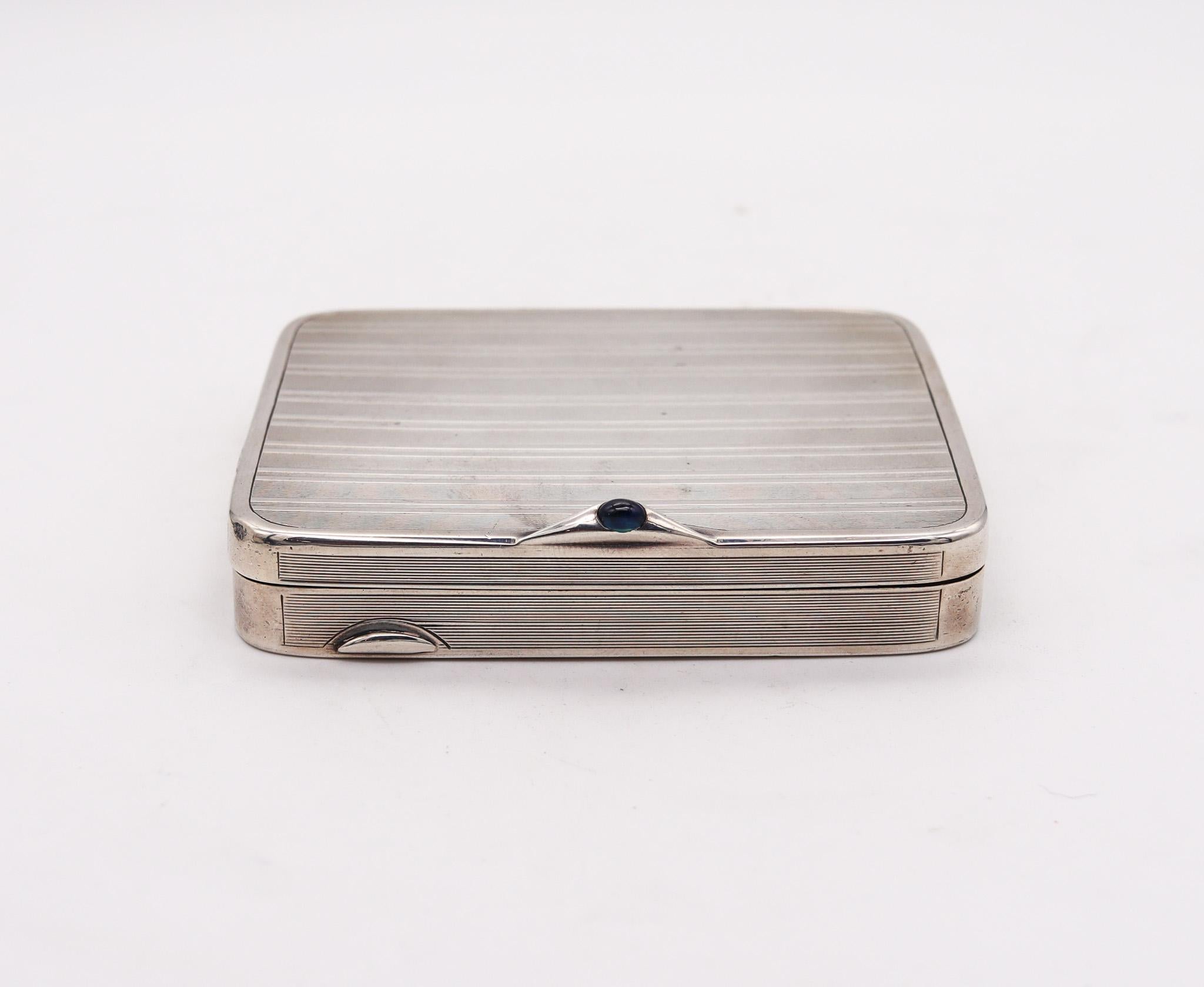 A hinged box designed by Ernest Cambeau.

A beautiful hinged box, created in Paris France by the silversmith Ernest Cambeau, back in the 1920. This box has been crafted in a cushion shape in solid sterling silver with a finesse of .950/.999. It is